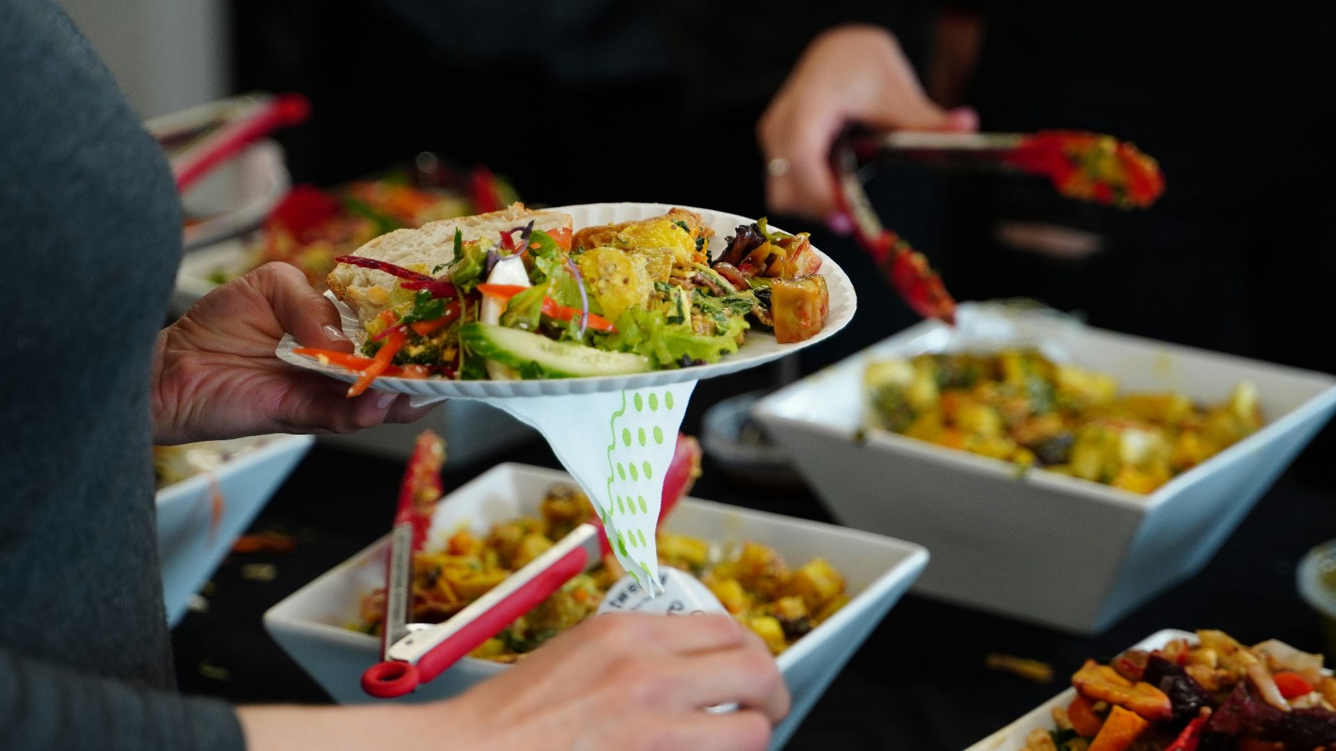 person holding white ceramic bowl with food