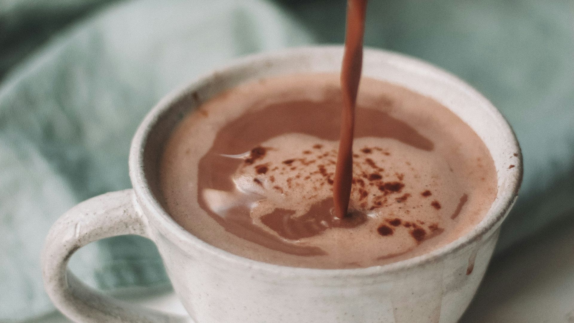 chocolate coffee pouring in white mug