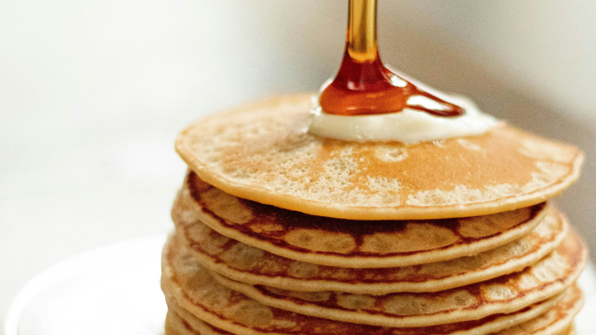 brown pancakes on white ceramic plate