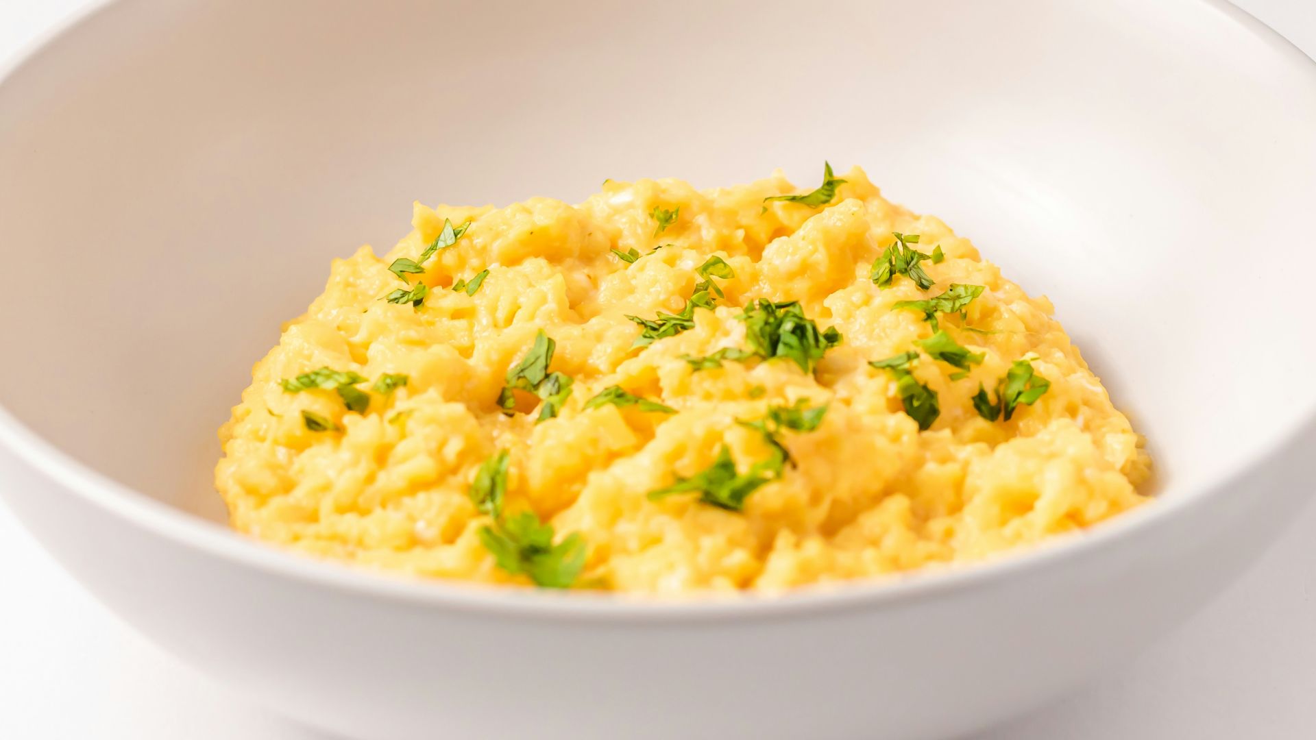 a close up of a bowl of food on a table