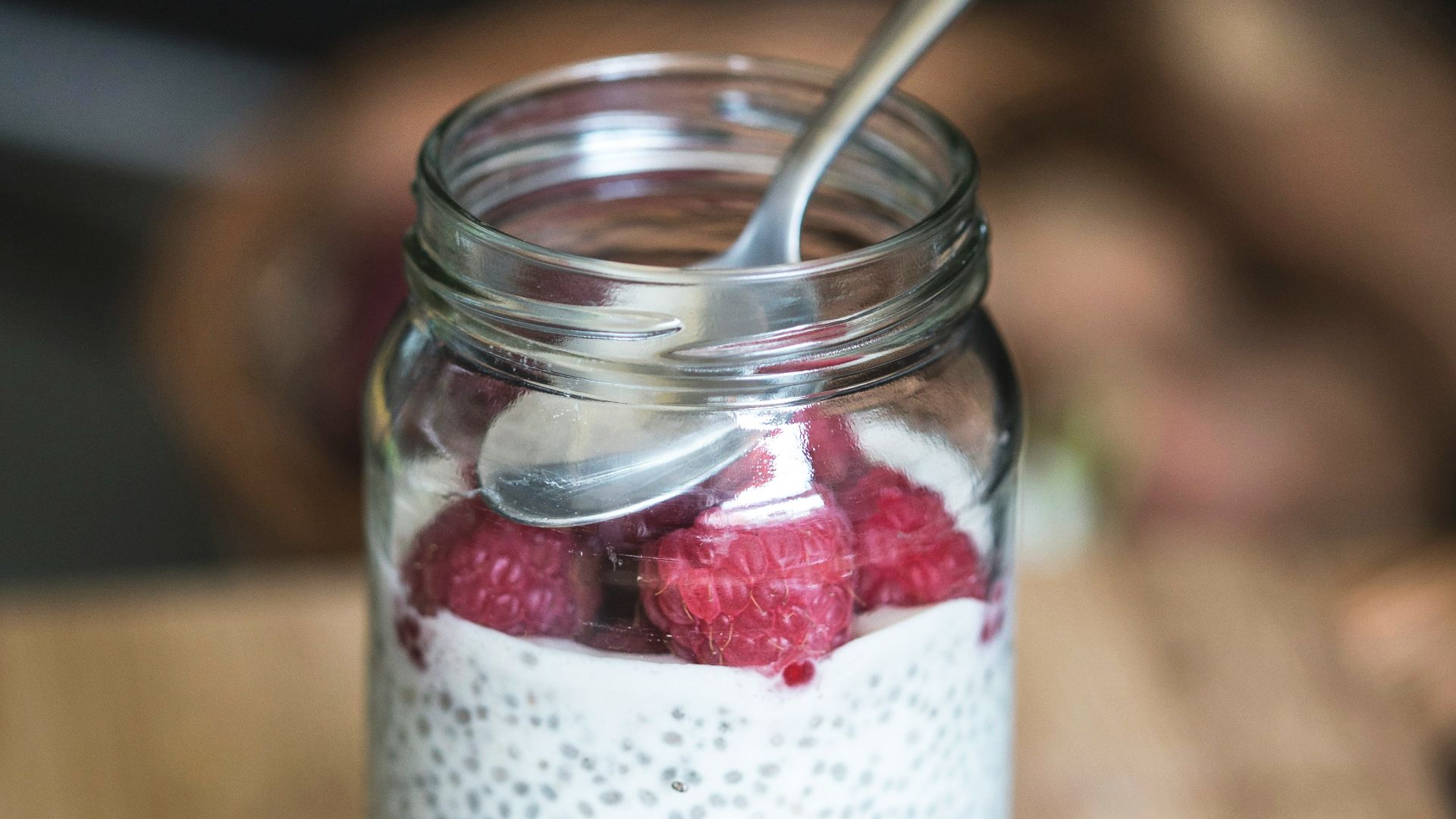 red cherries on clear glass bowl
