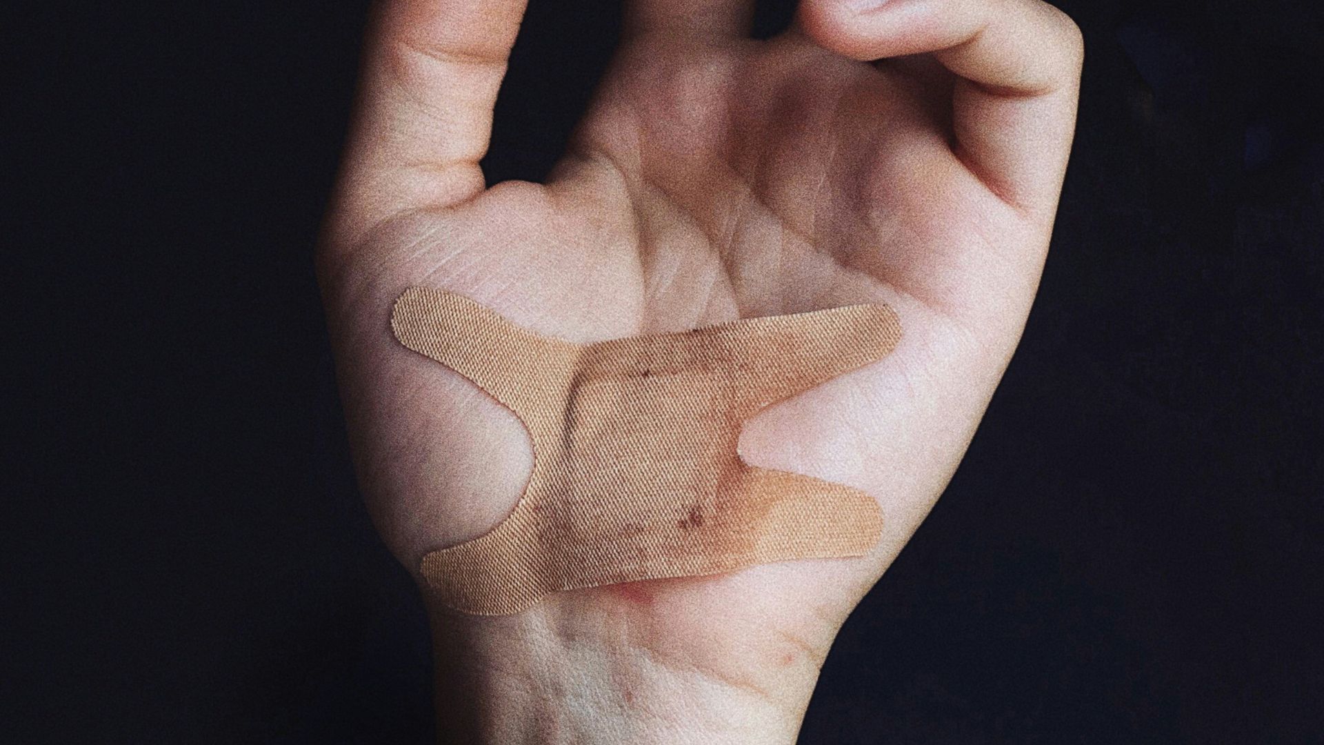 person's left palm with bandage