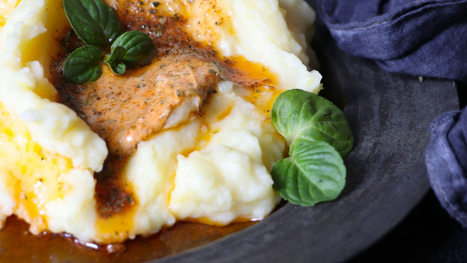 a plate of mashed potatoes topped with gravy