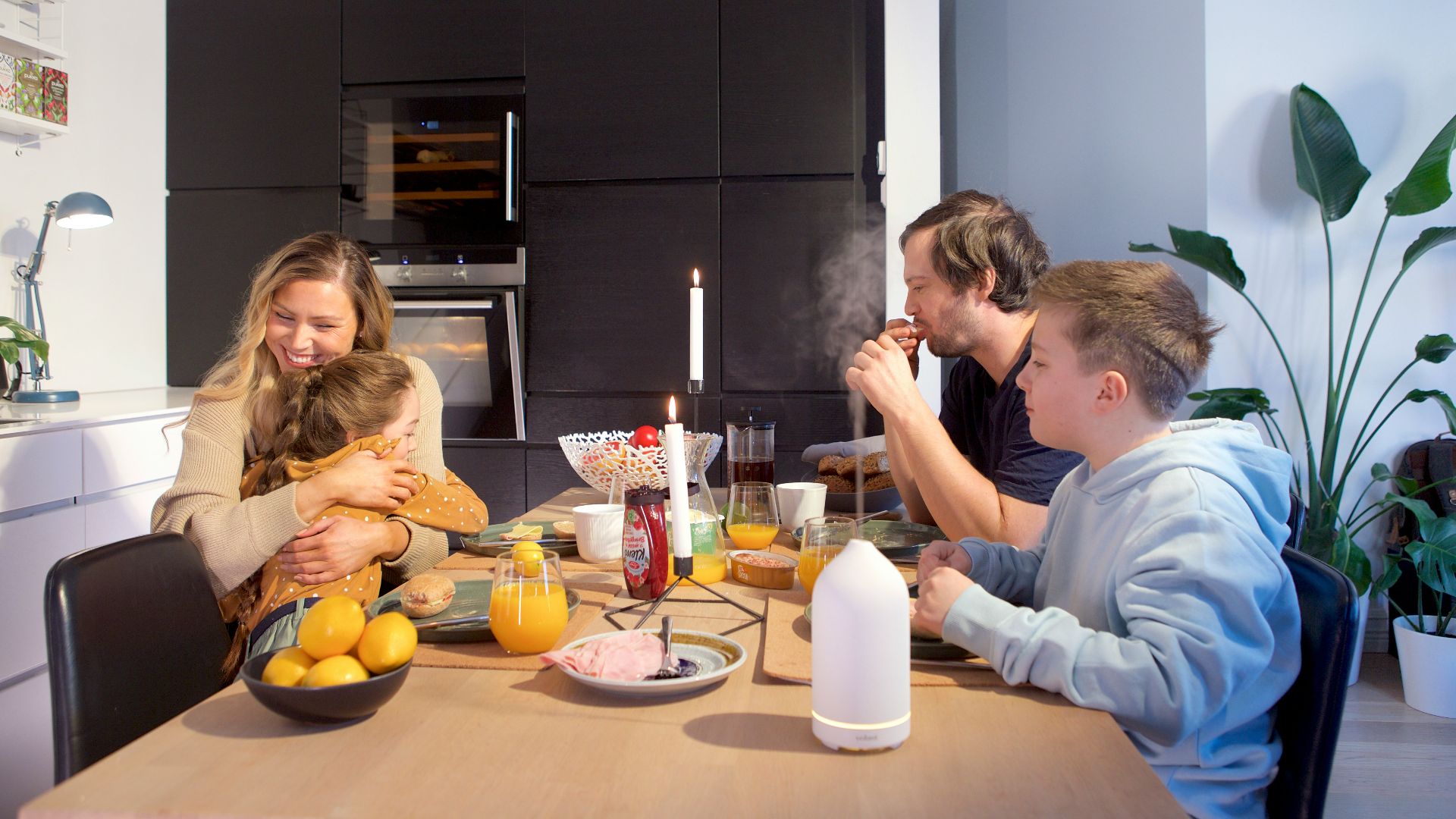 a group of people sitting around a table eating food