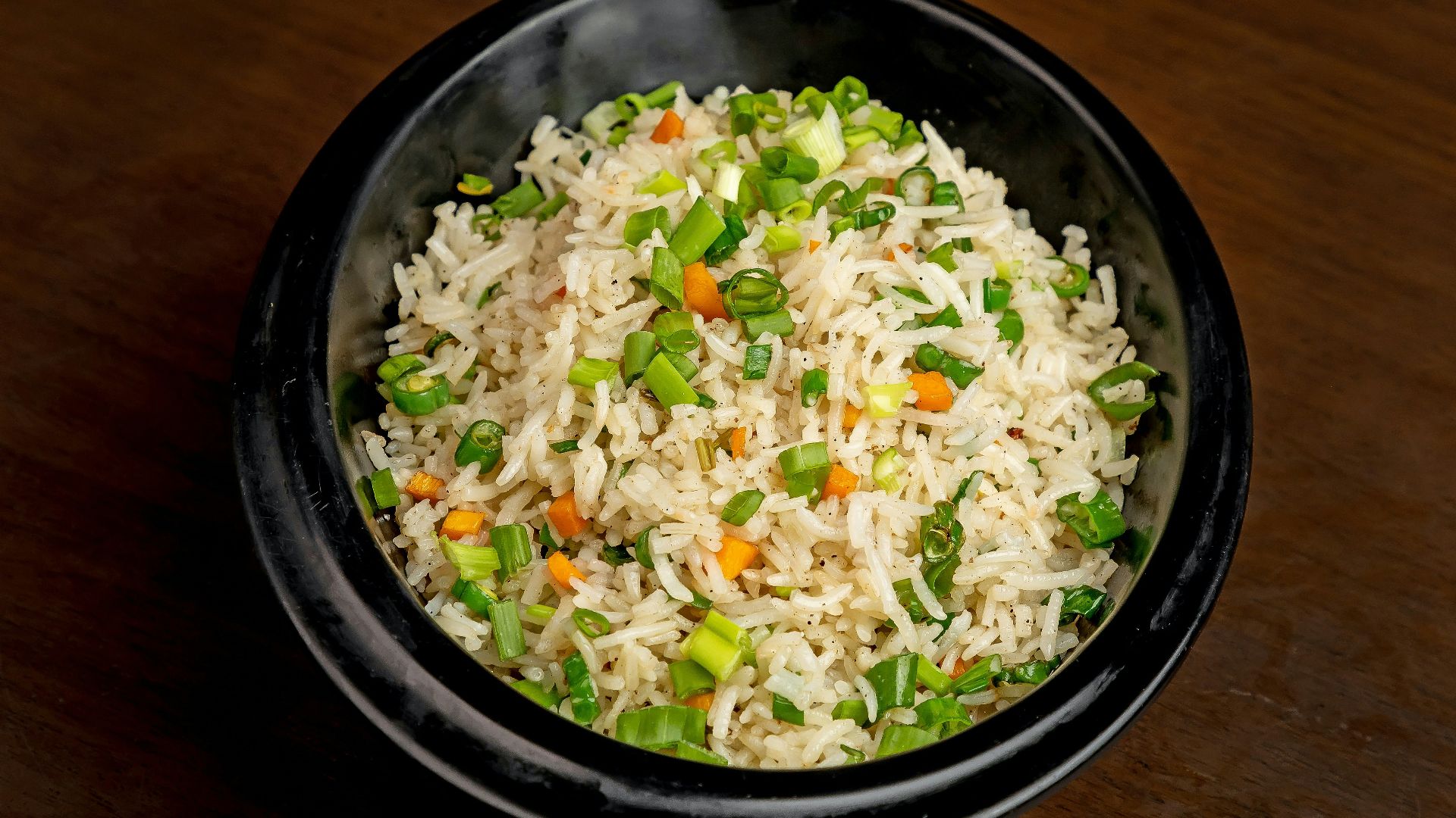 a bowl of rice with vegetables