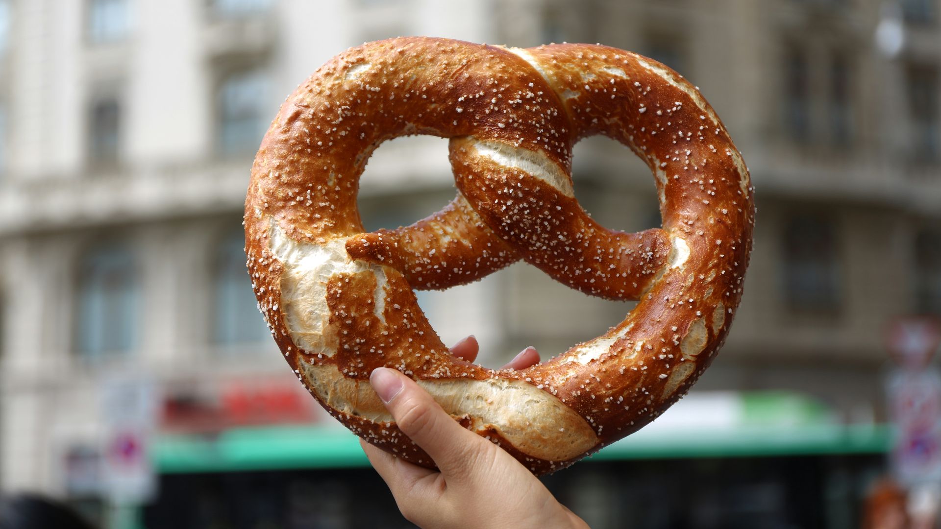 person holding pretzel