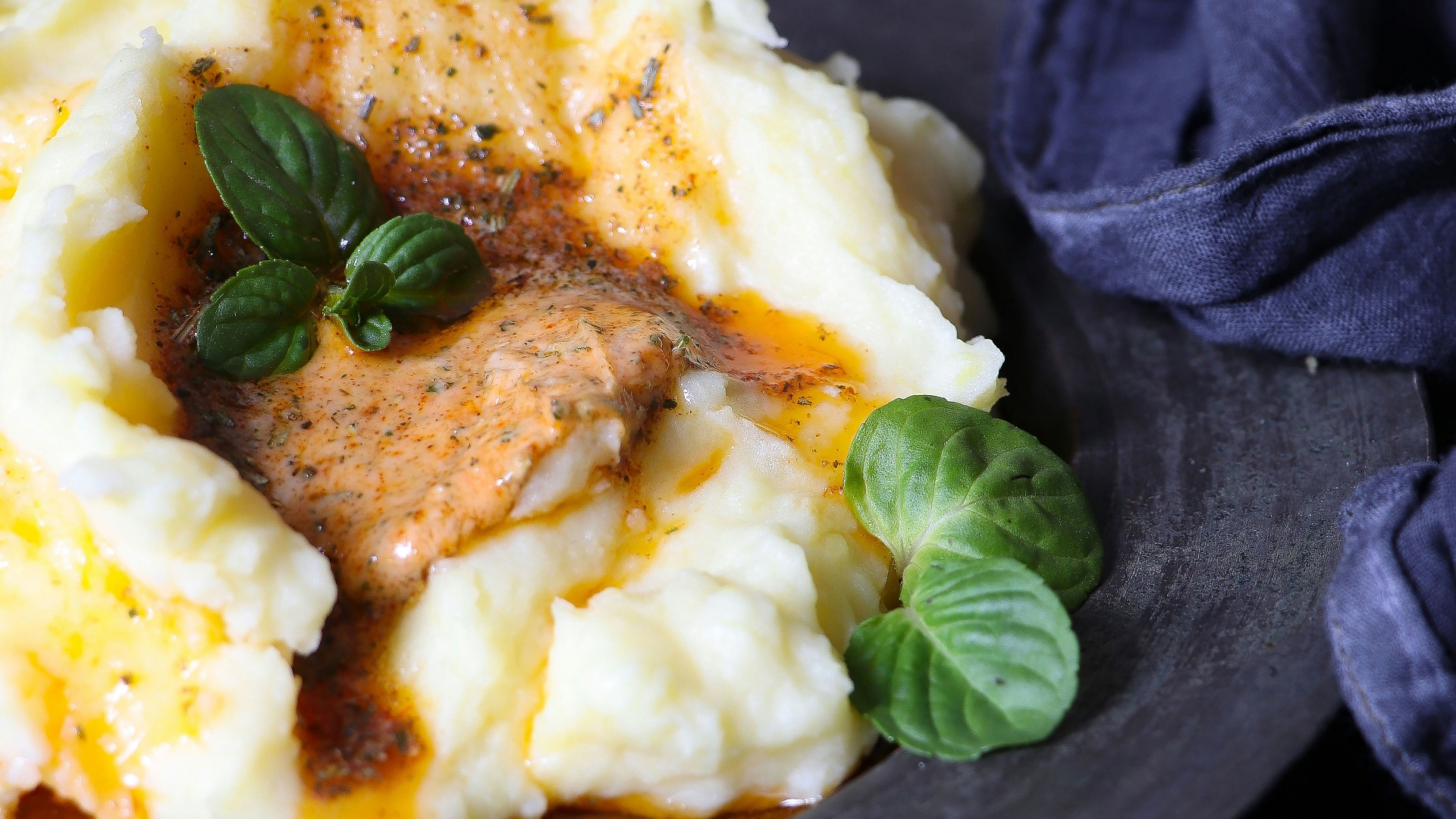 a plate of mashed potatoes topped with gravy