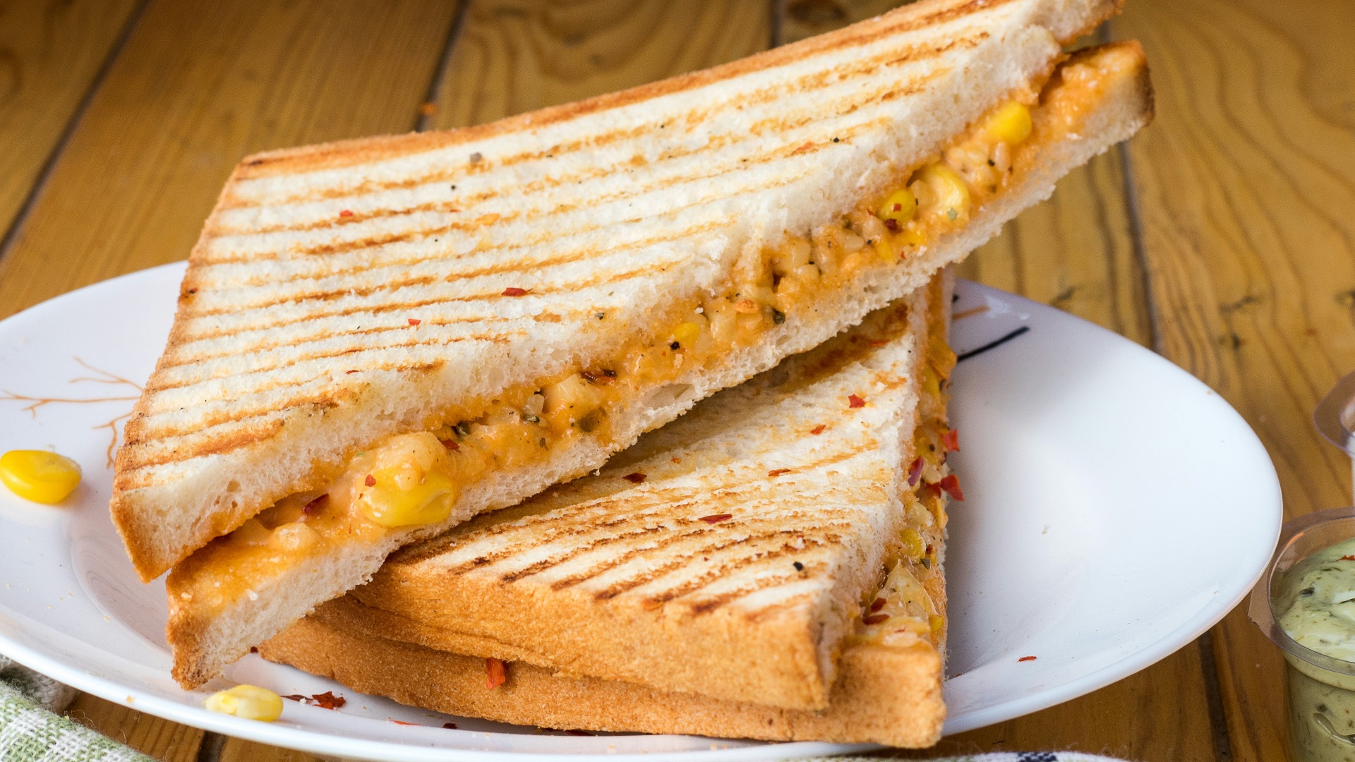 bread with cheese fillings on white ceramic plate