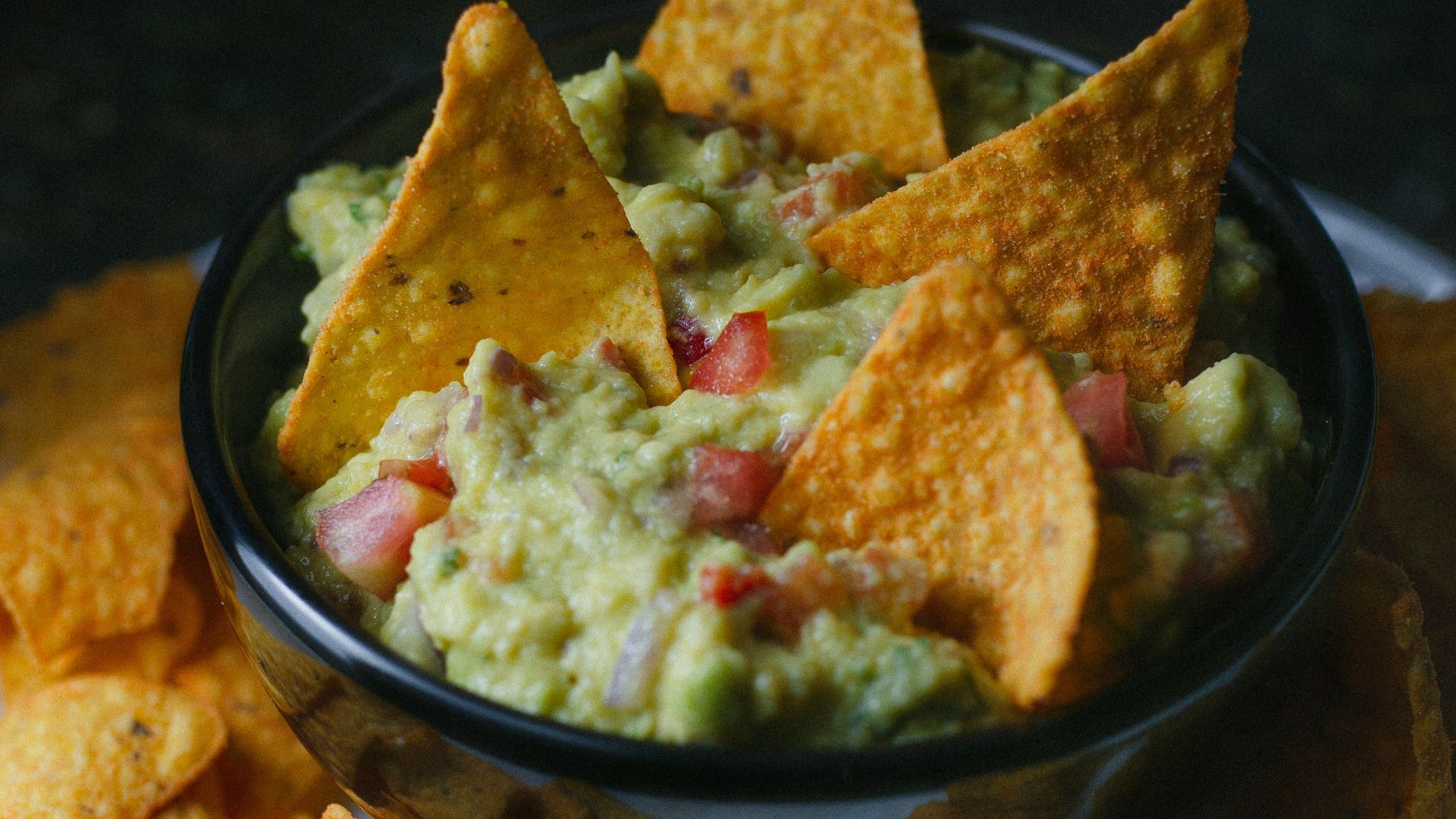 green vegetable on black ceramic bowl