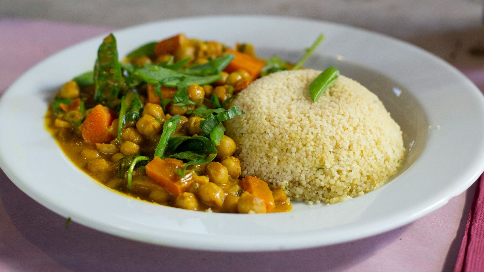 rice with green leaf vegetable on white ceramic plate