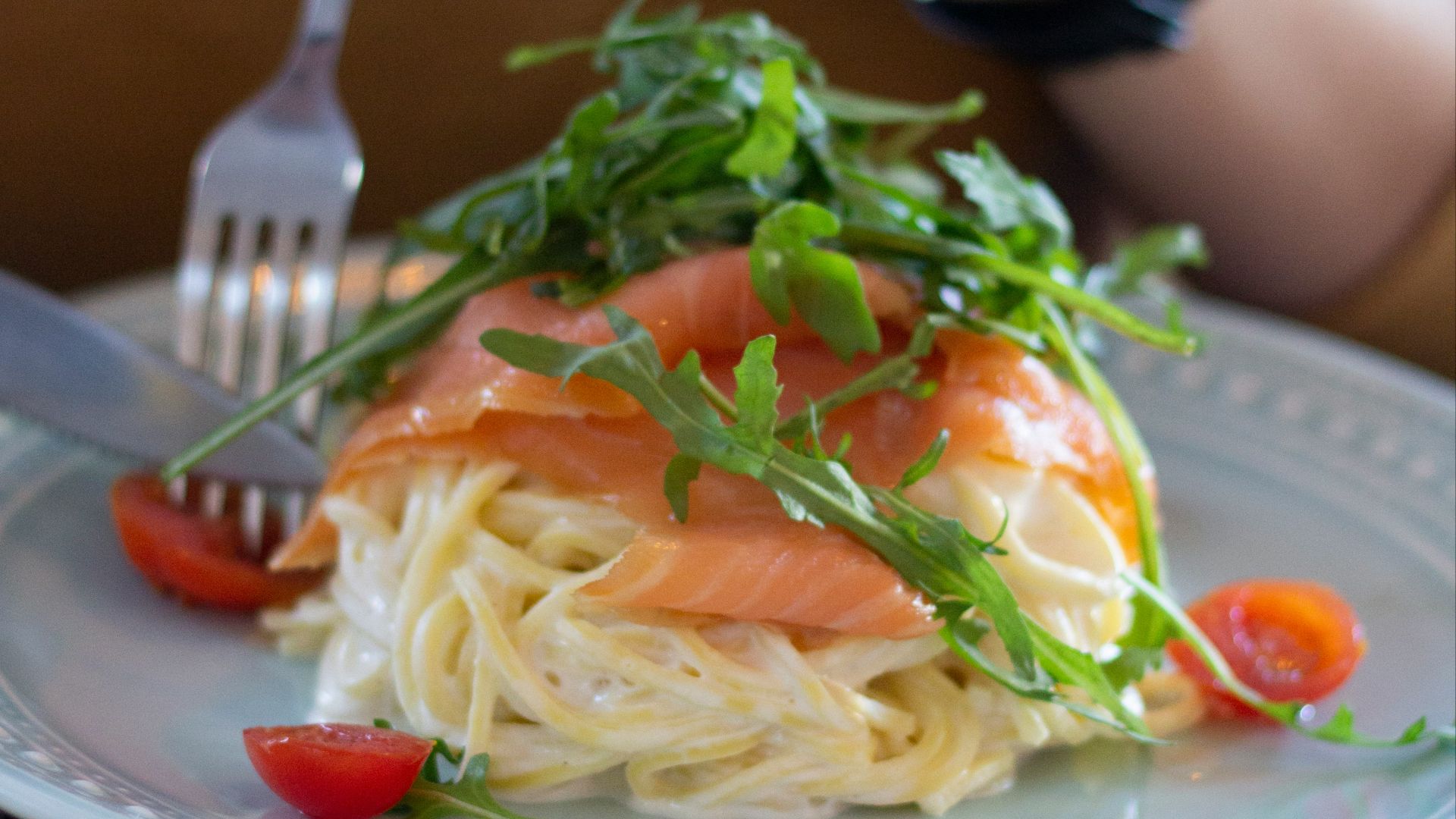 person holding stainless steel fork