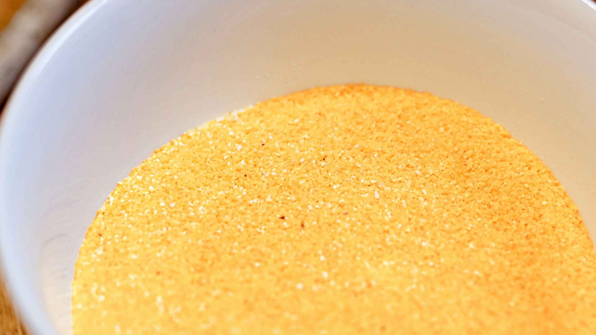 a bowl of soup on a cutting board with a spoon
