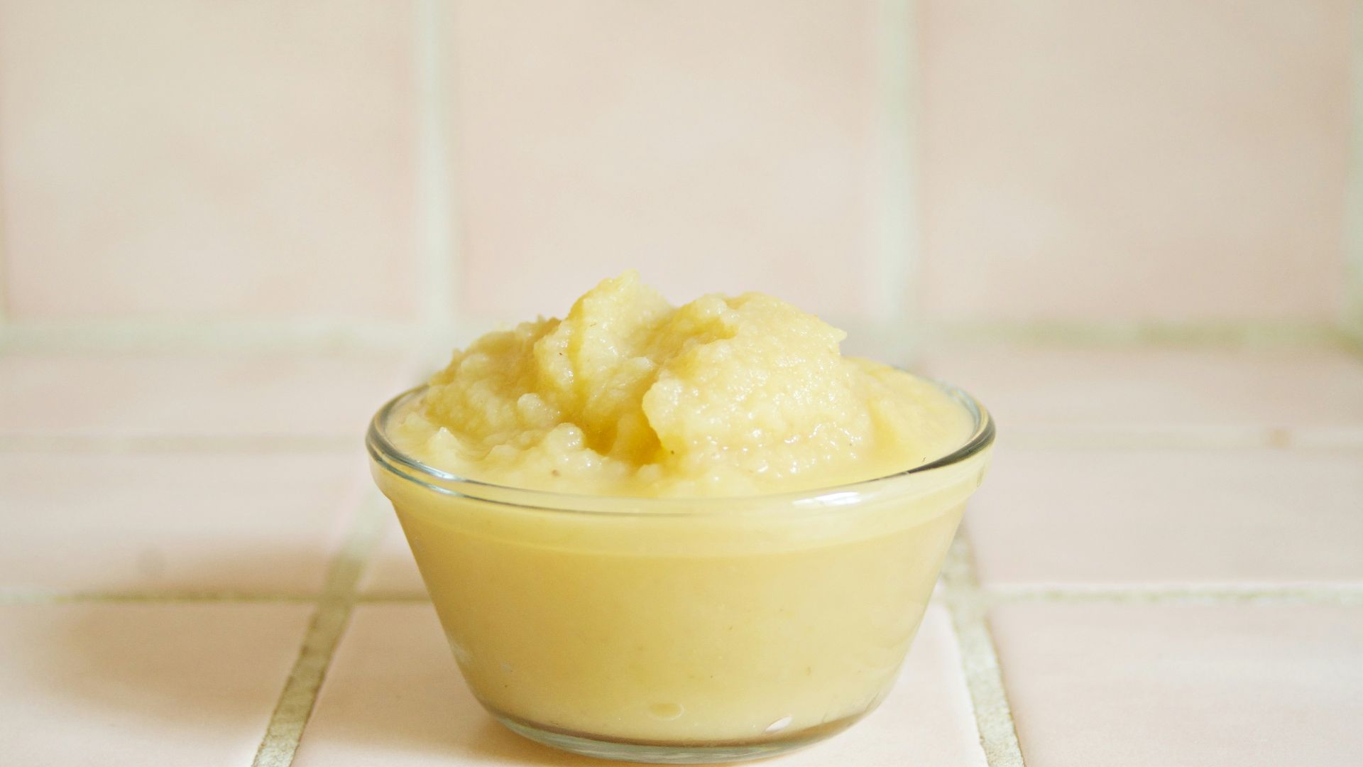 yellow cream in clear glass bowl