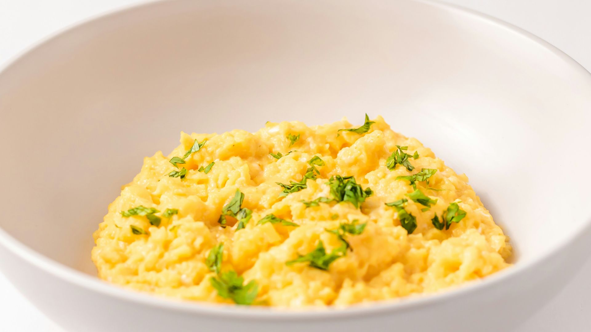 a close up of a bowl of food on a table