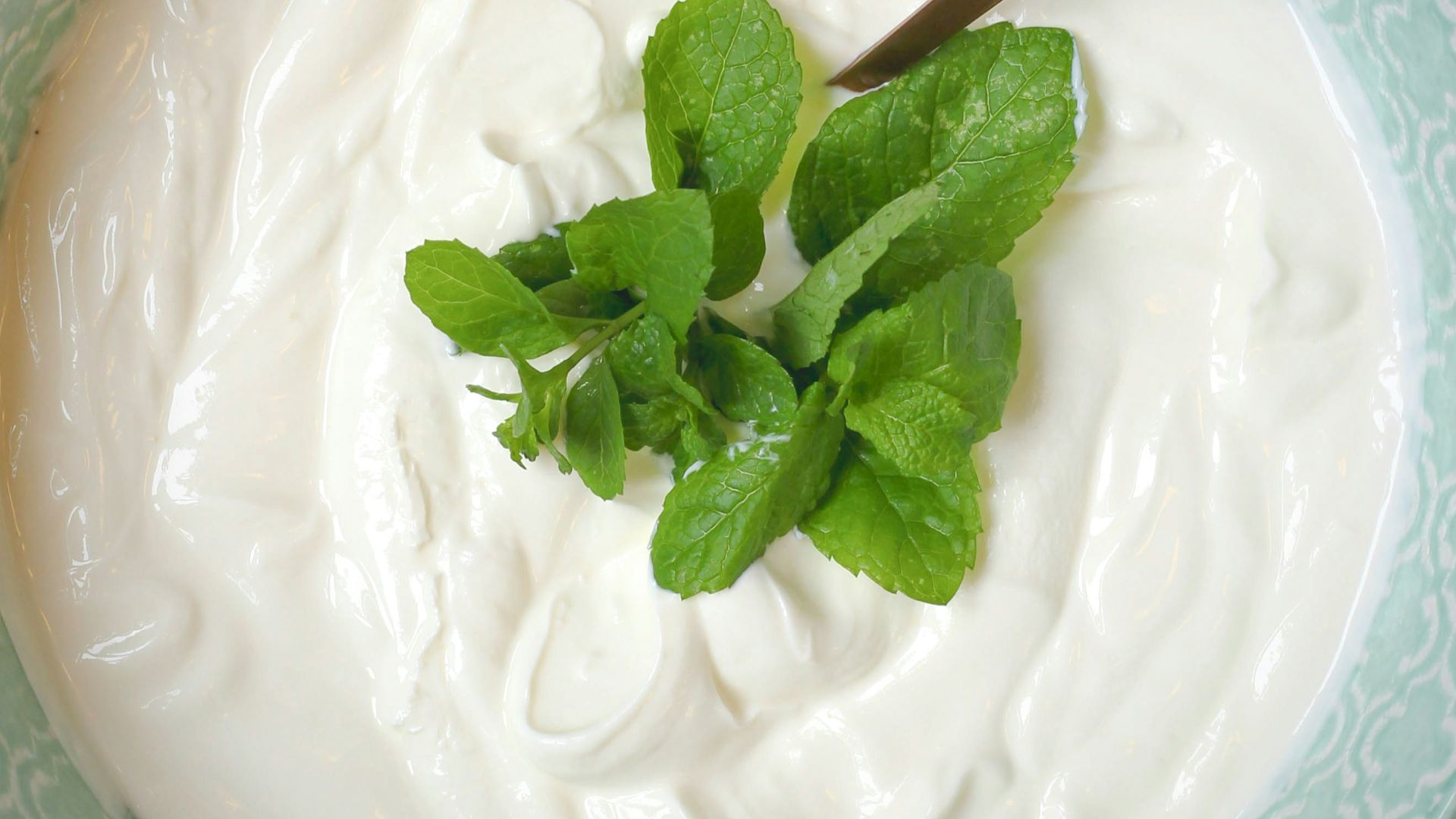 a bowl of yogurt with a spoon in it