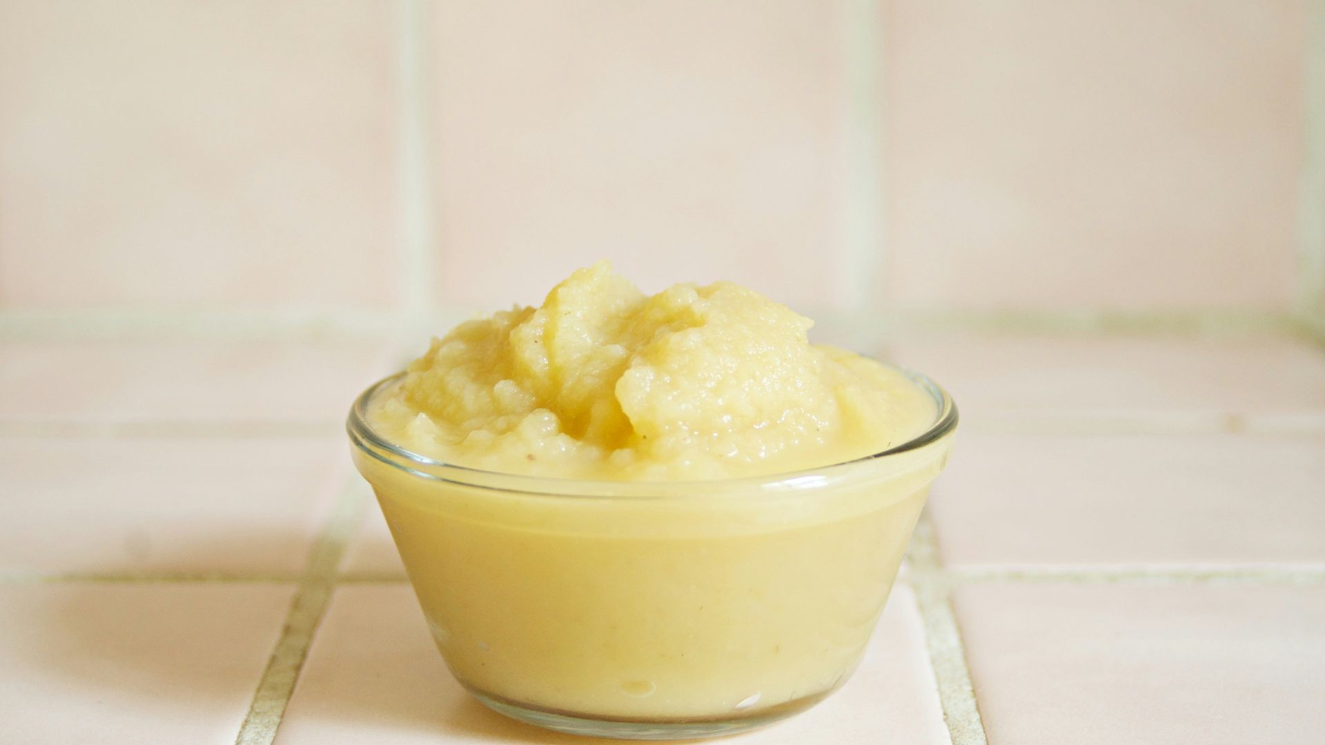 yellow cream in clear glass bowl