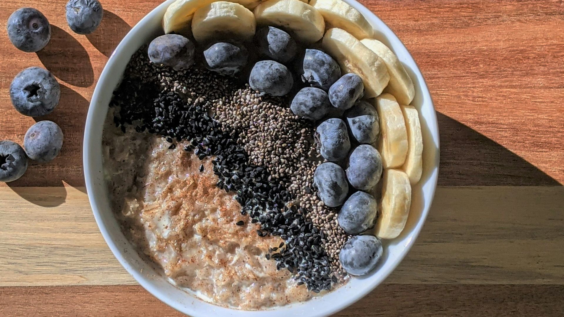 brown and black beans in white ceramic bowl