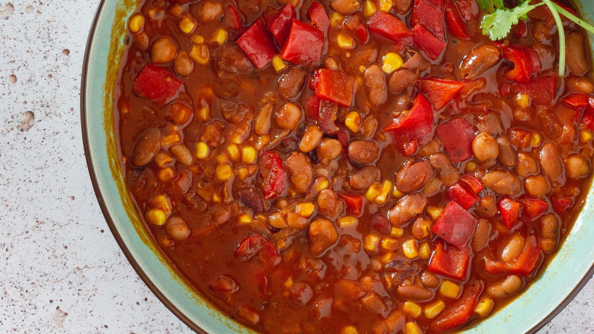 red and green chili peppers in white ceramic bowl