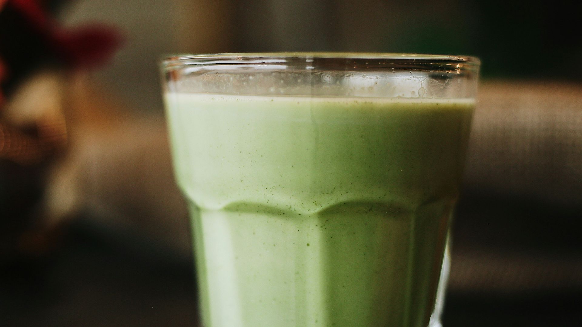 green liquid in clear drinking glass
