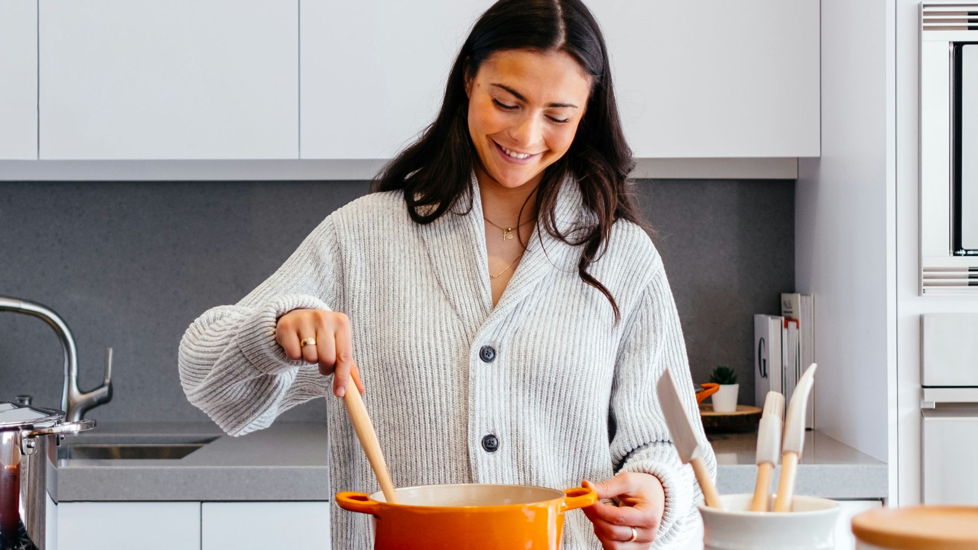 woman cooking inside kitchen room