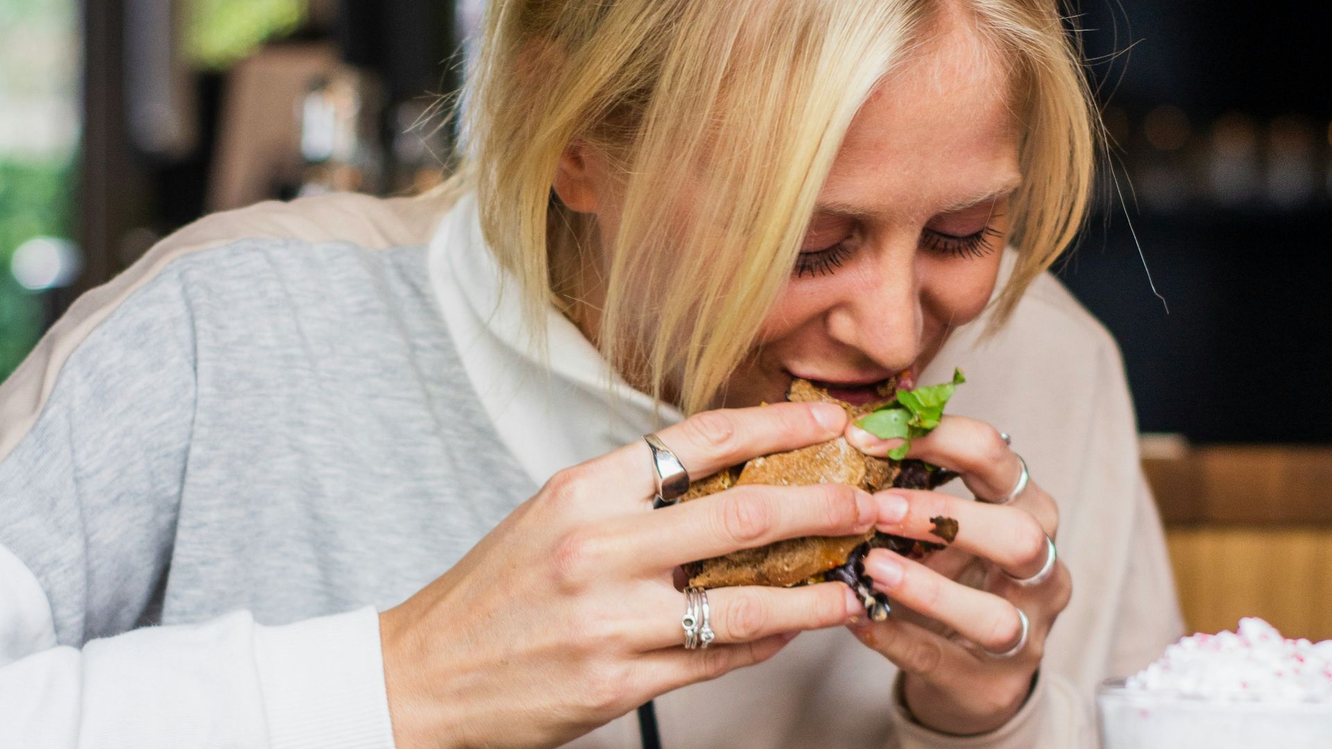 woman eating burger