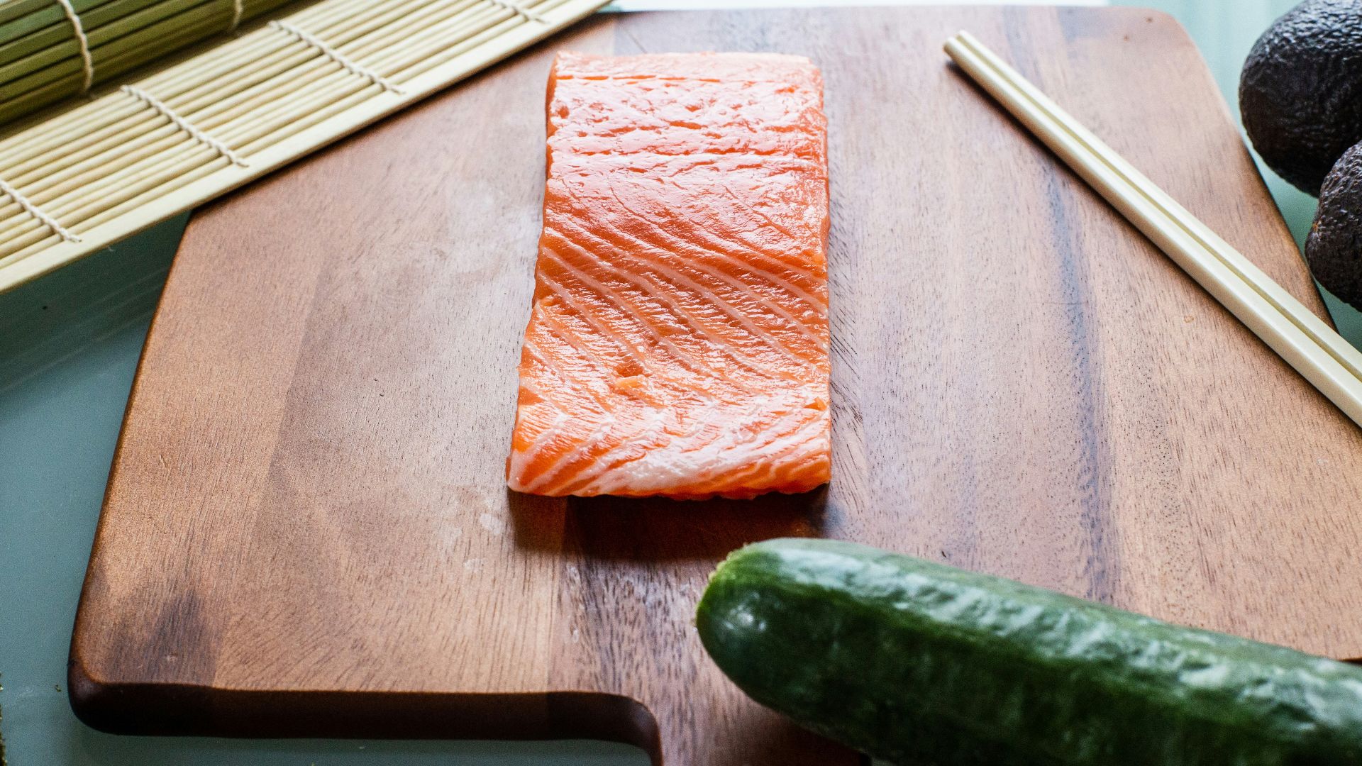 green cucumber on brown textile