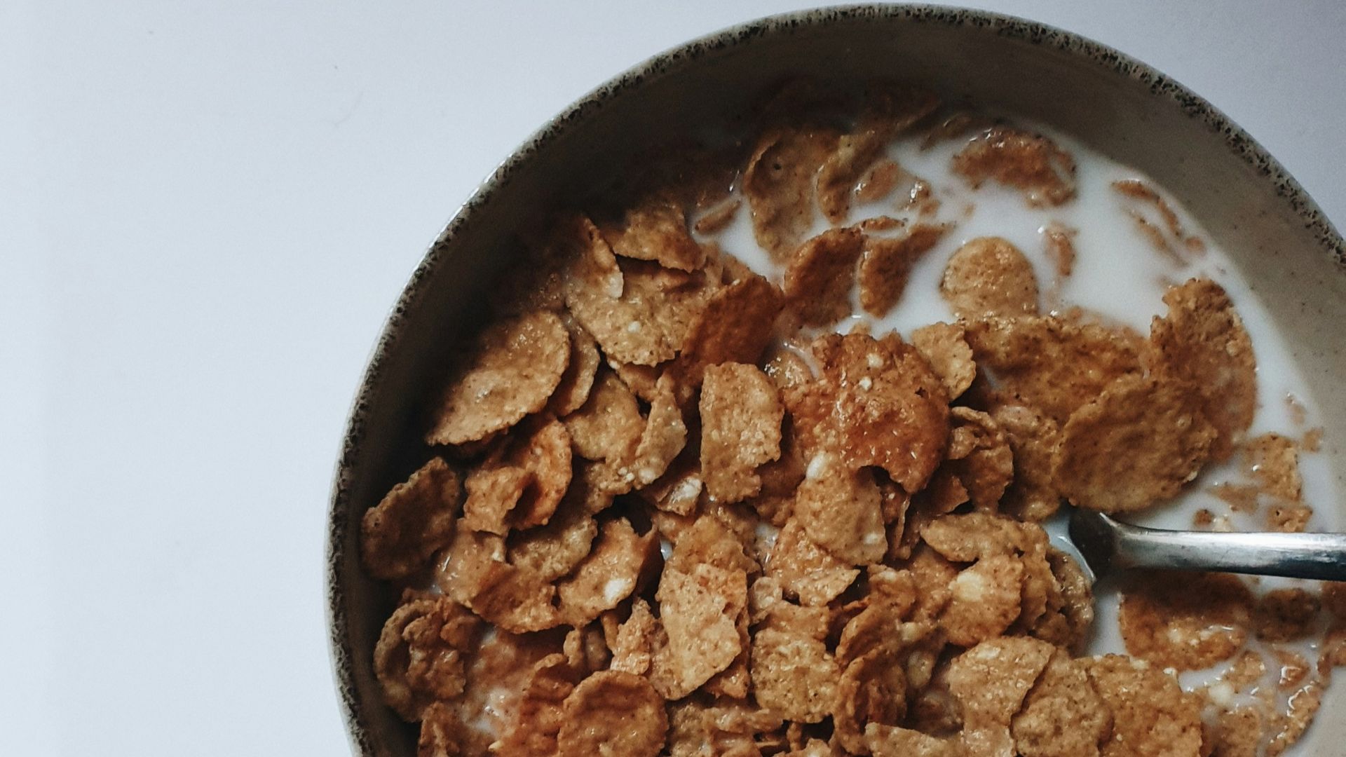 a bowl of cereal with a spoon in it