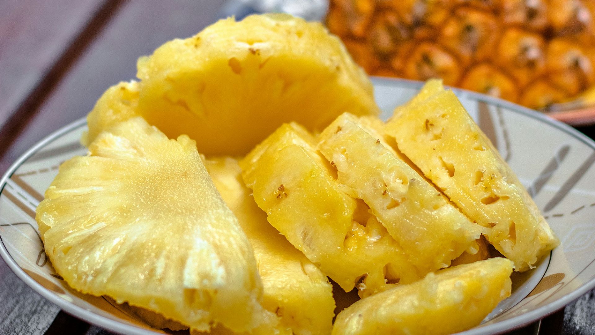 sliced pineapple on white ceramic plate