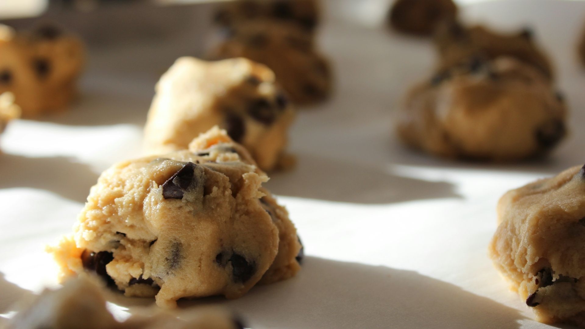 round chocolate cookies on white surface