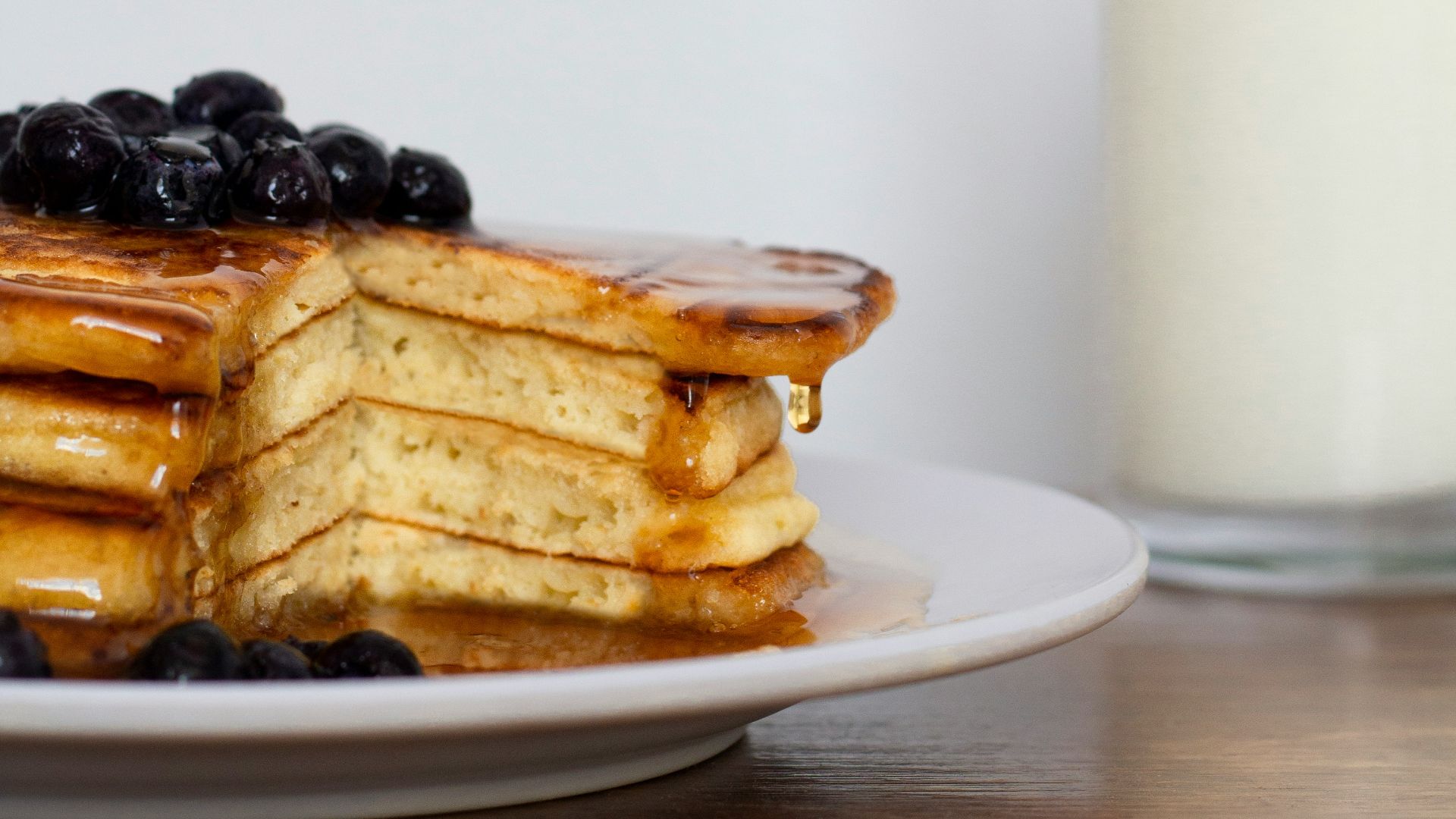 waffle with white cream on white ceramic plate