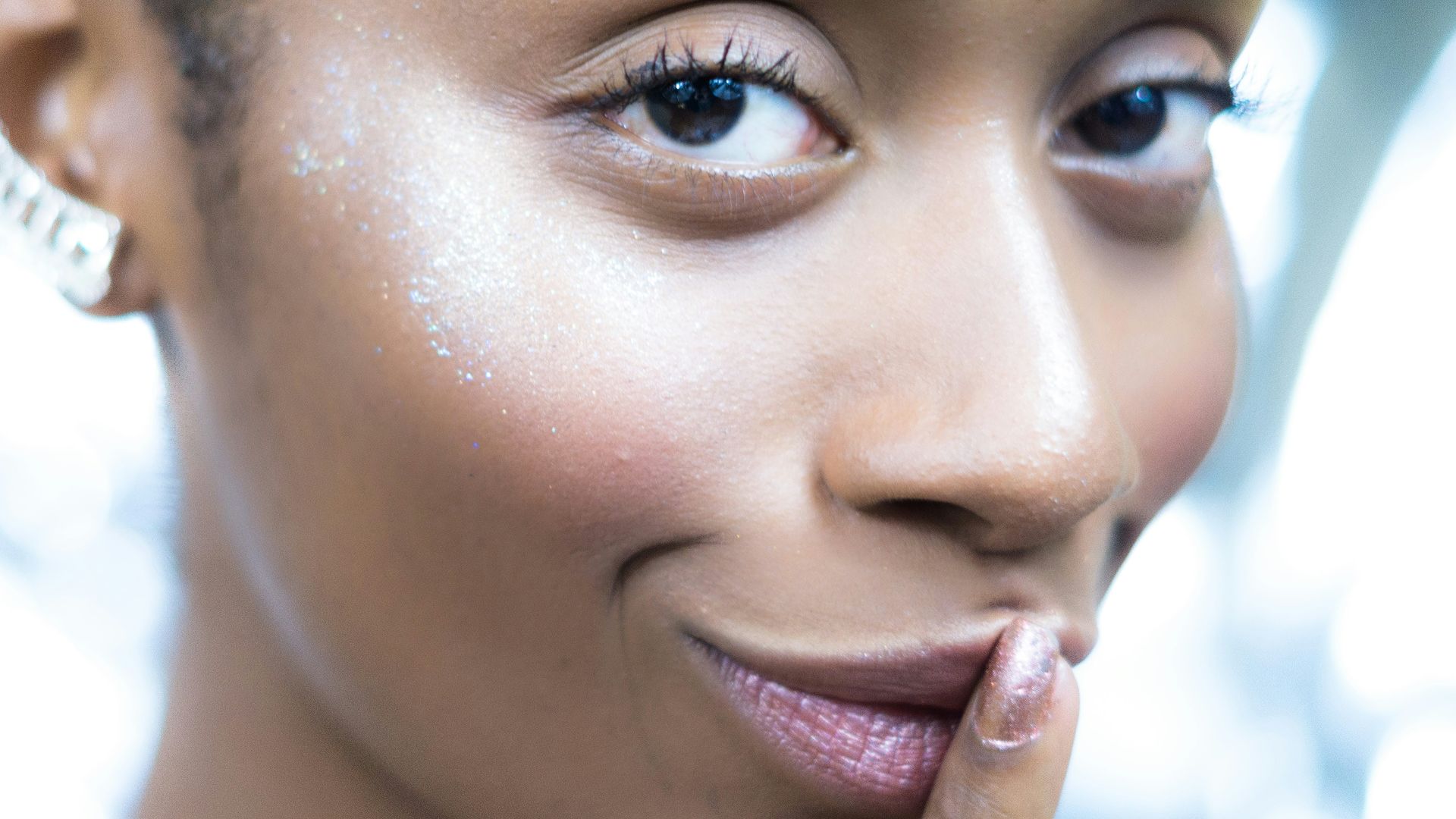 a close up of a person with a ring on her finger