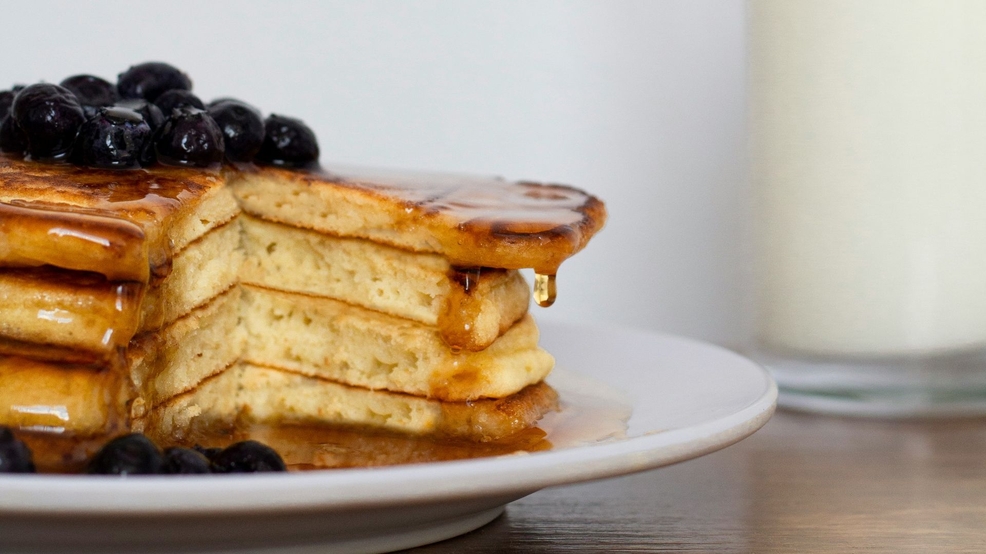 waffle with white cream on white ceramic plate
