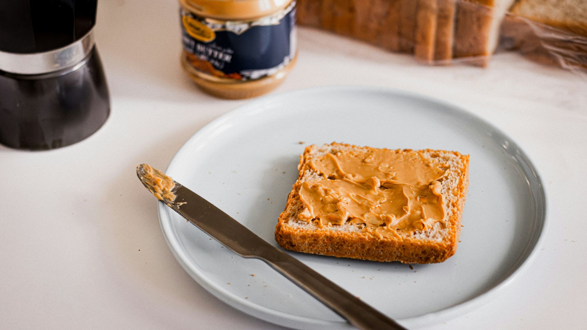 a piece of bread sitting on top of a white plate