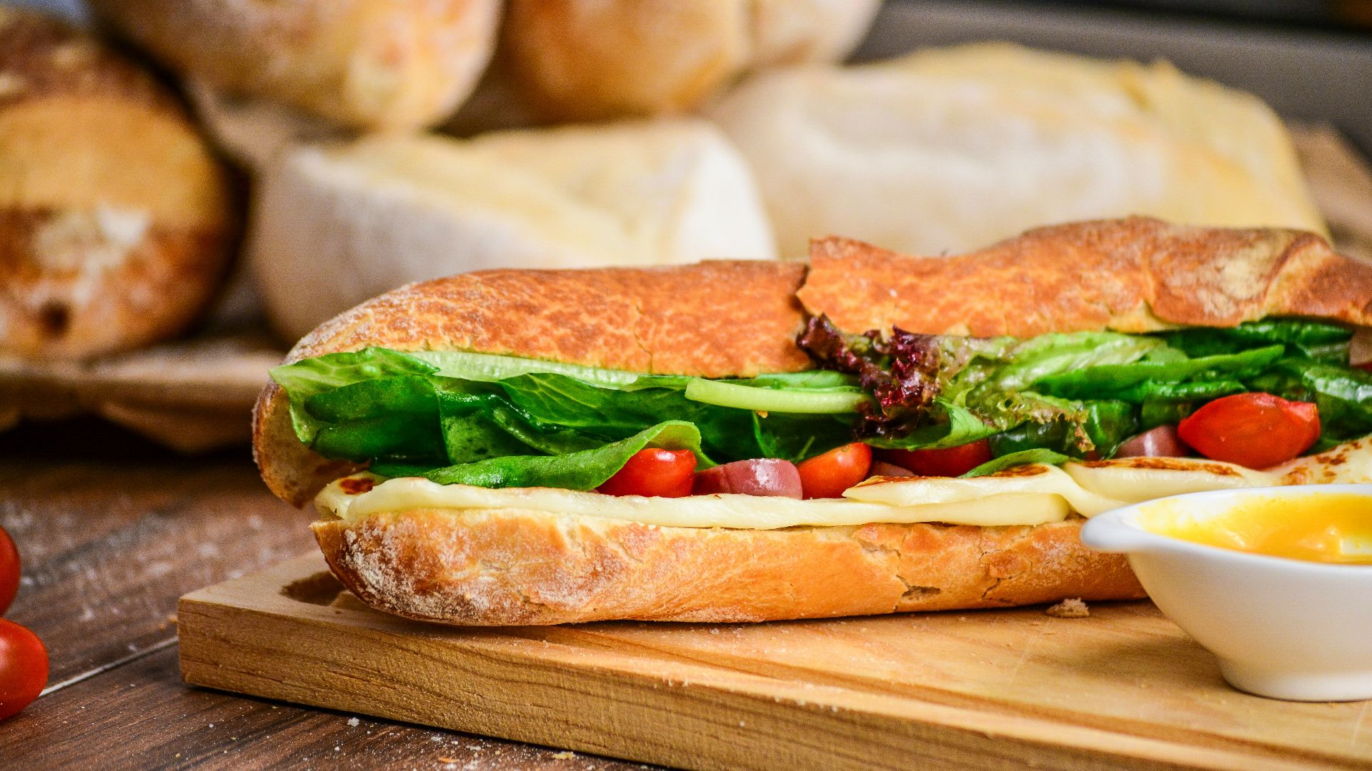 baked bread with vegetable on brown chopping board