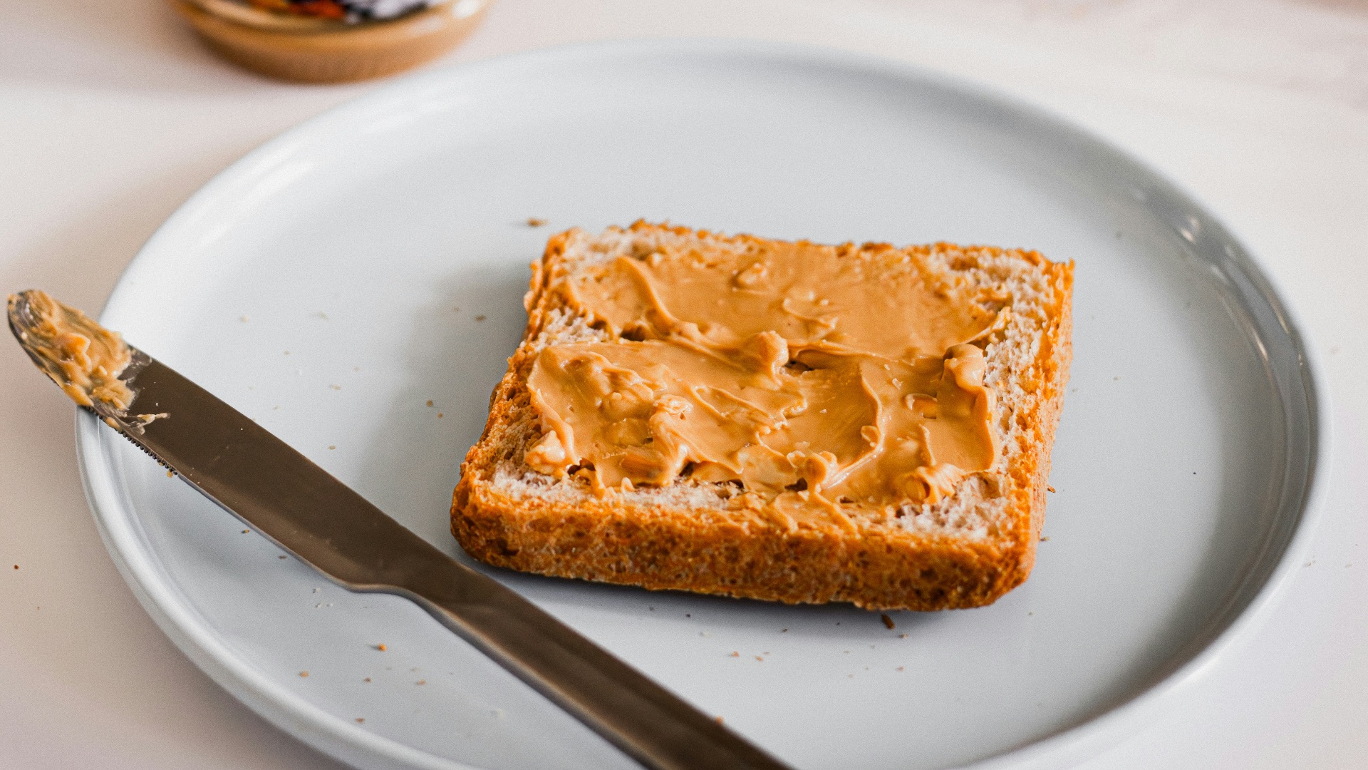 a piece of bread sitting on top of a white plate