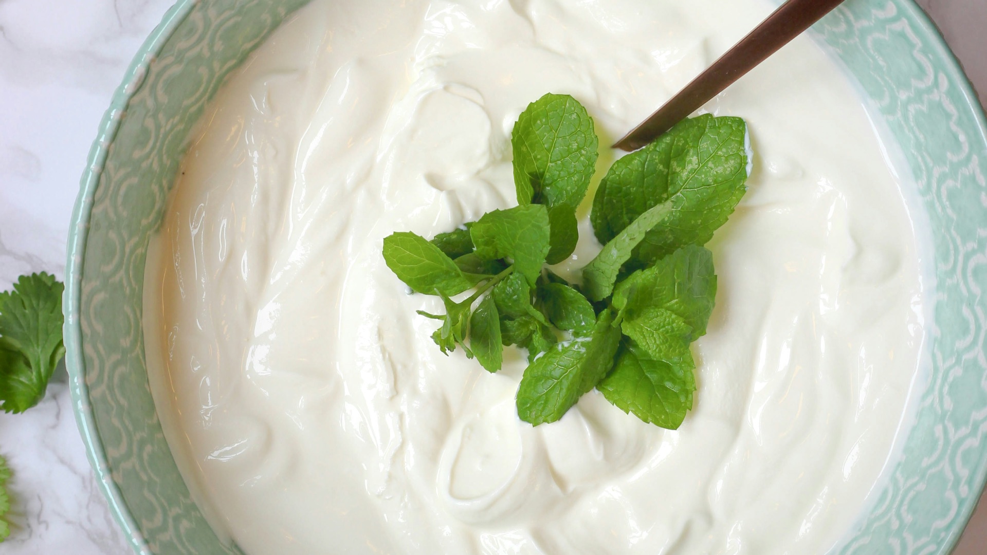 a bowl of yogurt with a spoon in it