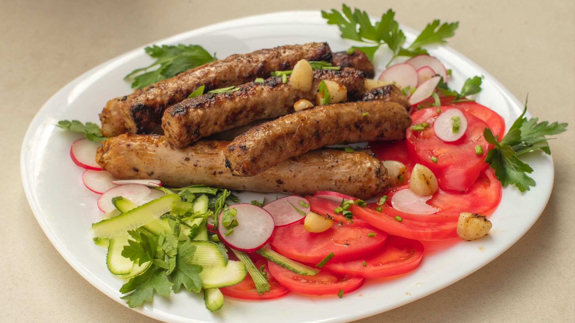 a white plate topped with meat and veggies