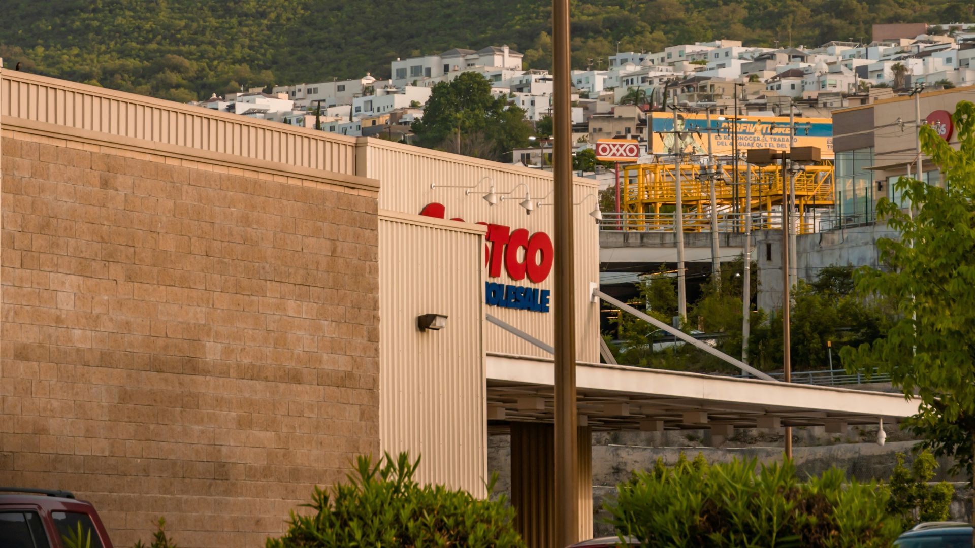 cars parked on parking lot near building during daytime