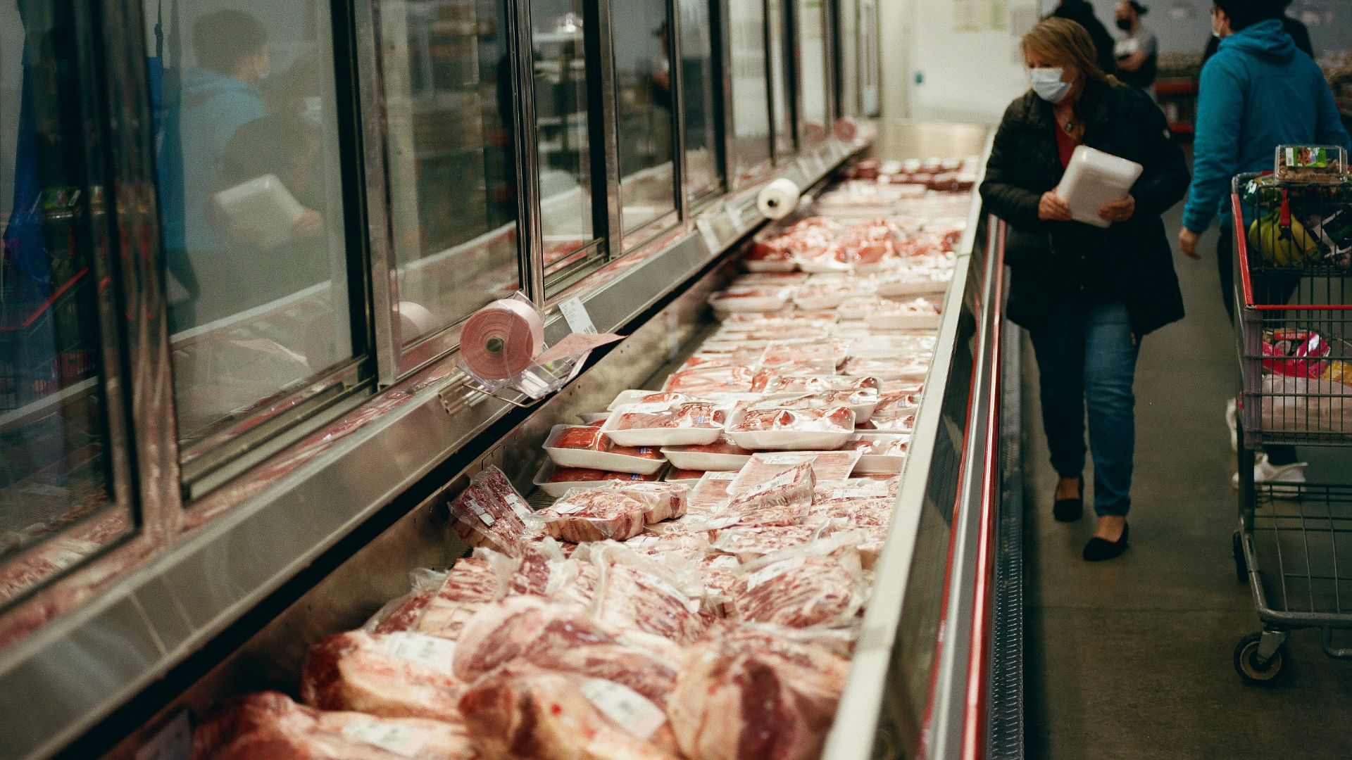 a line of meat in a grocery store