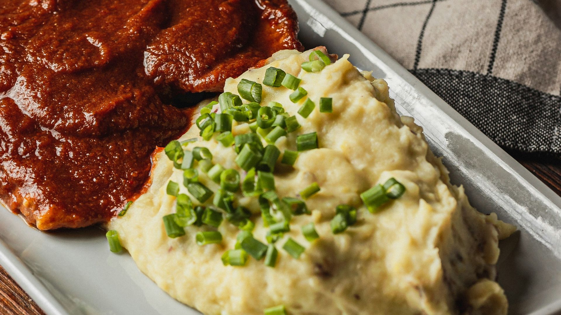 Chicken in sauce with rice and mashed potatoes