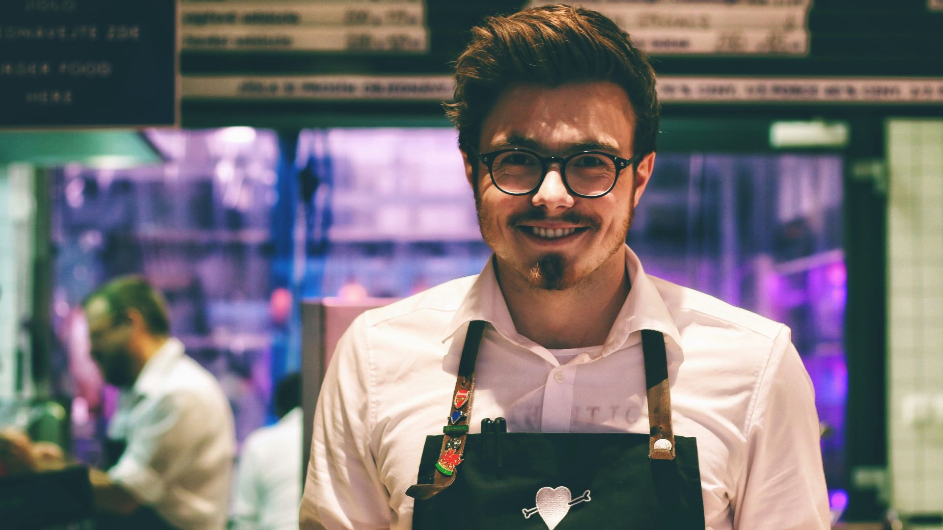 man holding fish dish on plate