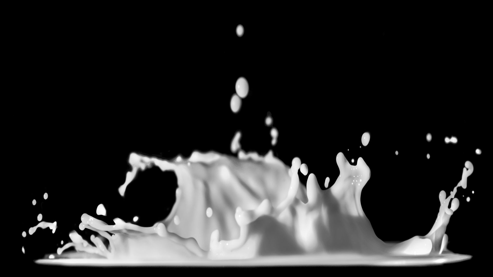 a black and white photo of a liquid splash