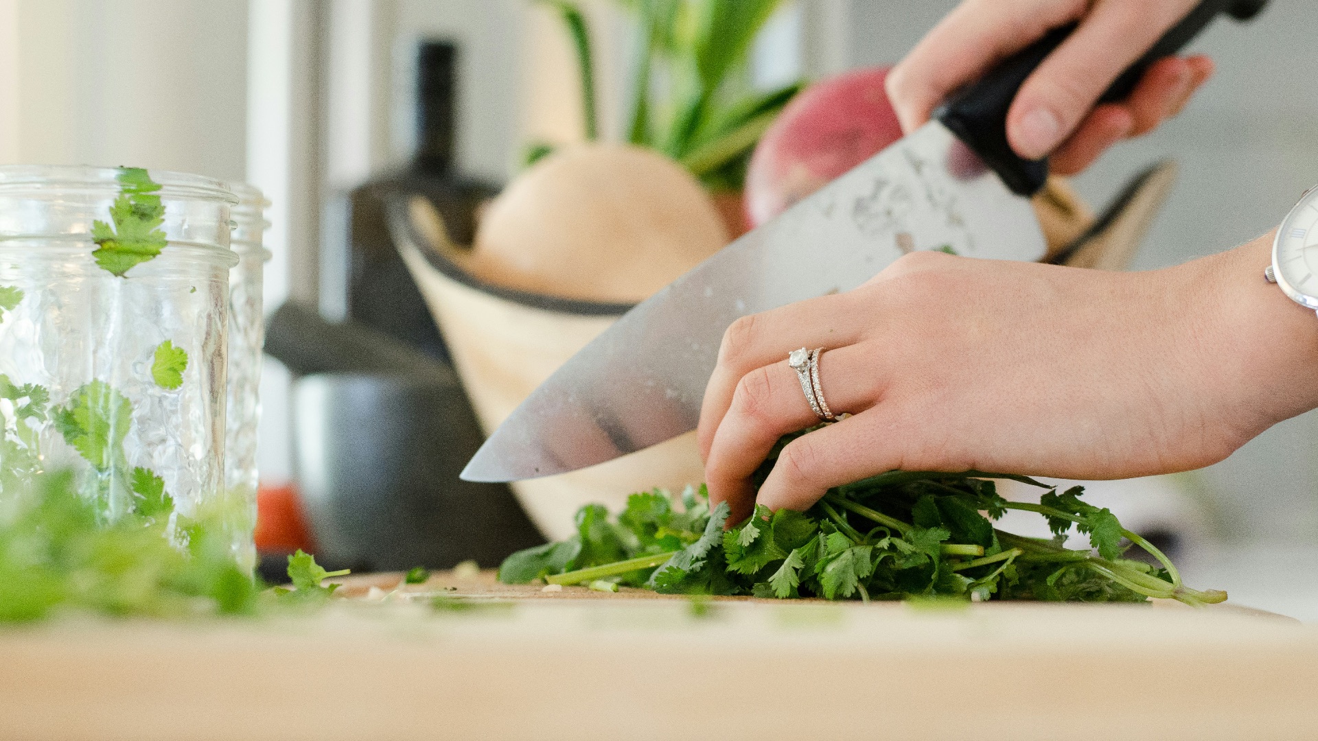 person cutting vegetables with knife