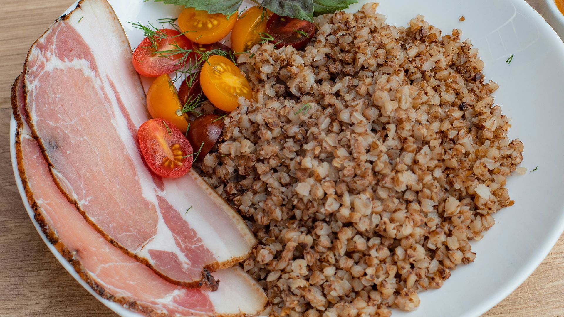 a white plate topped with meat and vegetables
