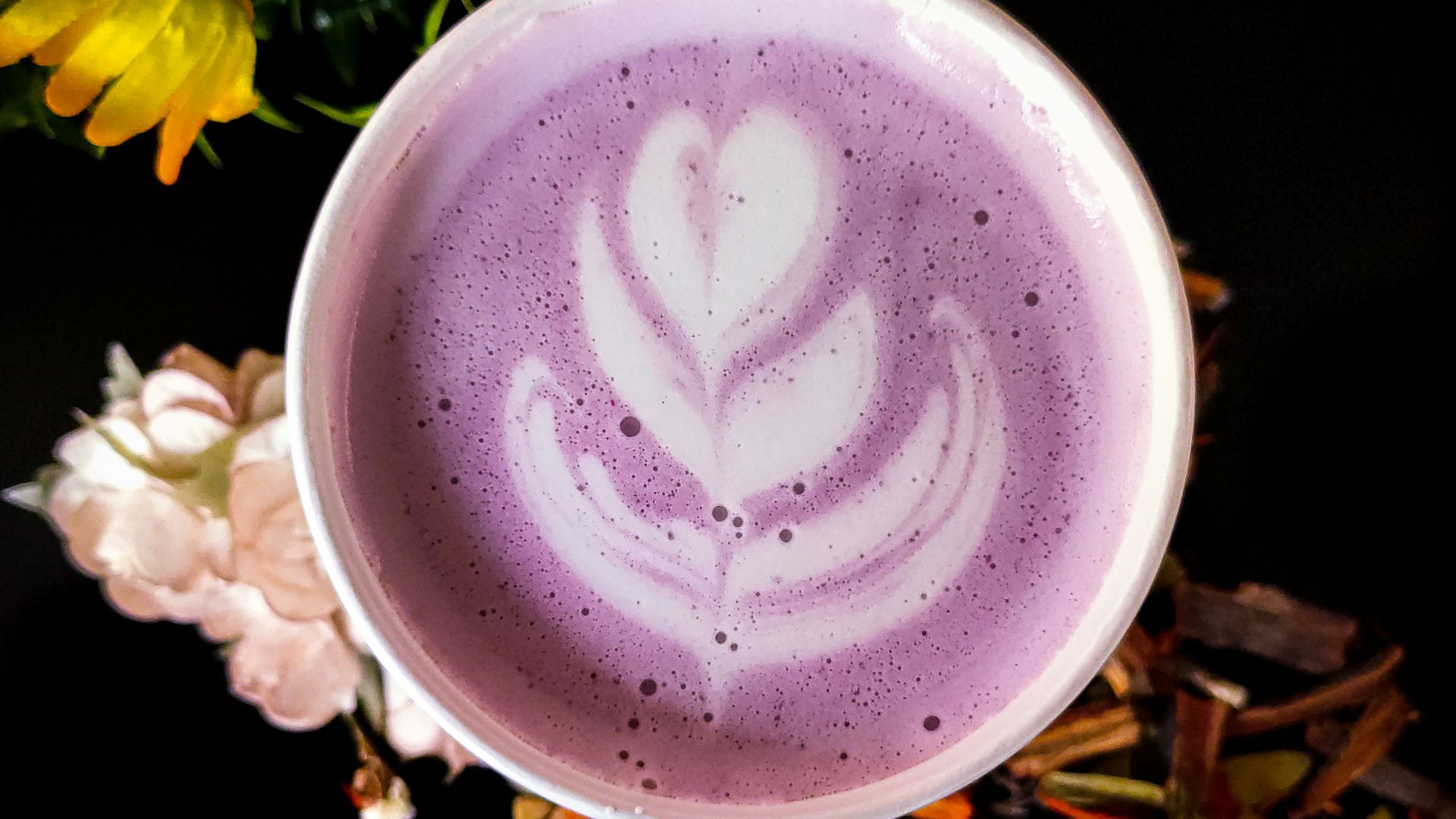 white ceramic cup with heart design