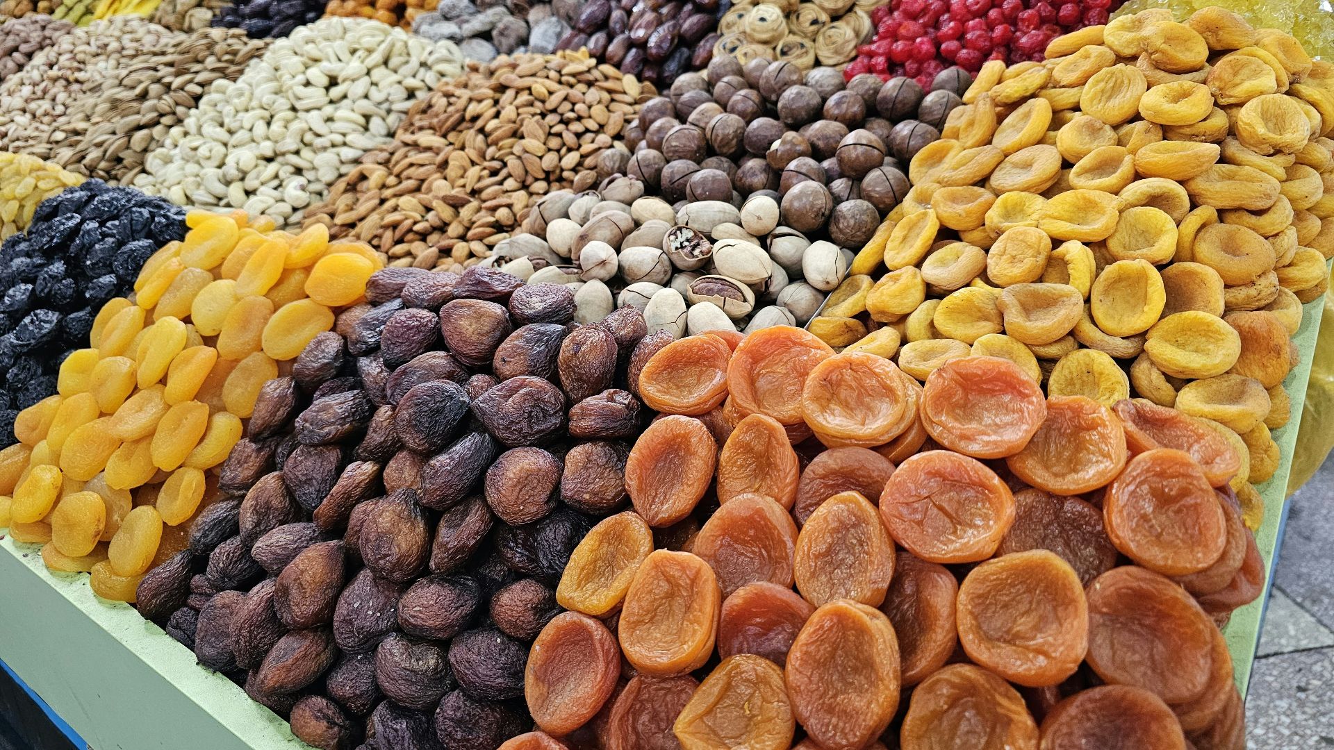 a display of dried fruits and nuts for sale