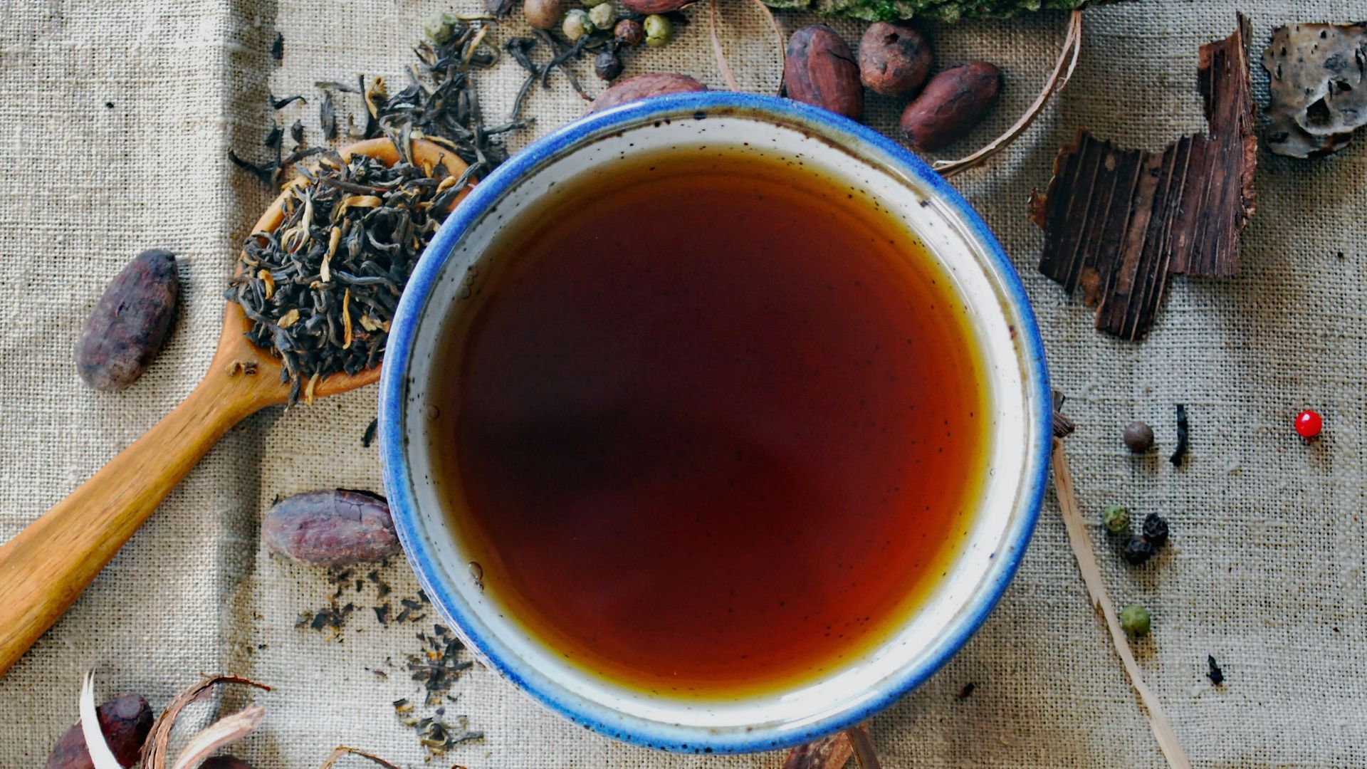 white and brown ceramic mug