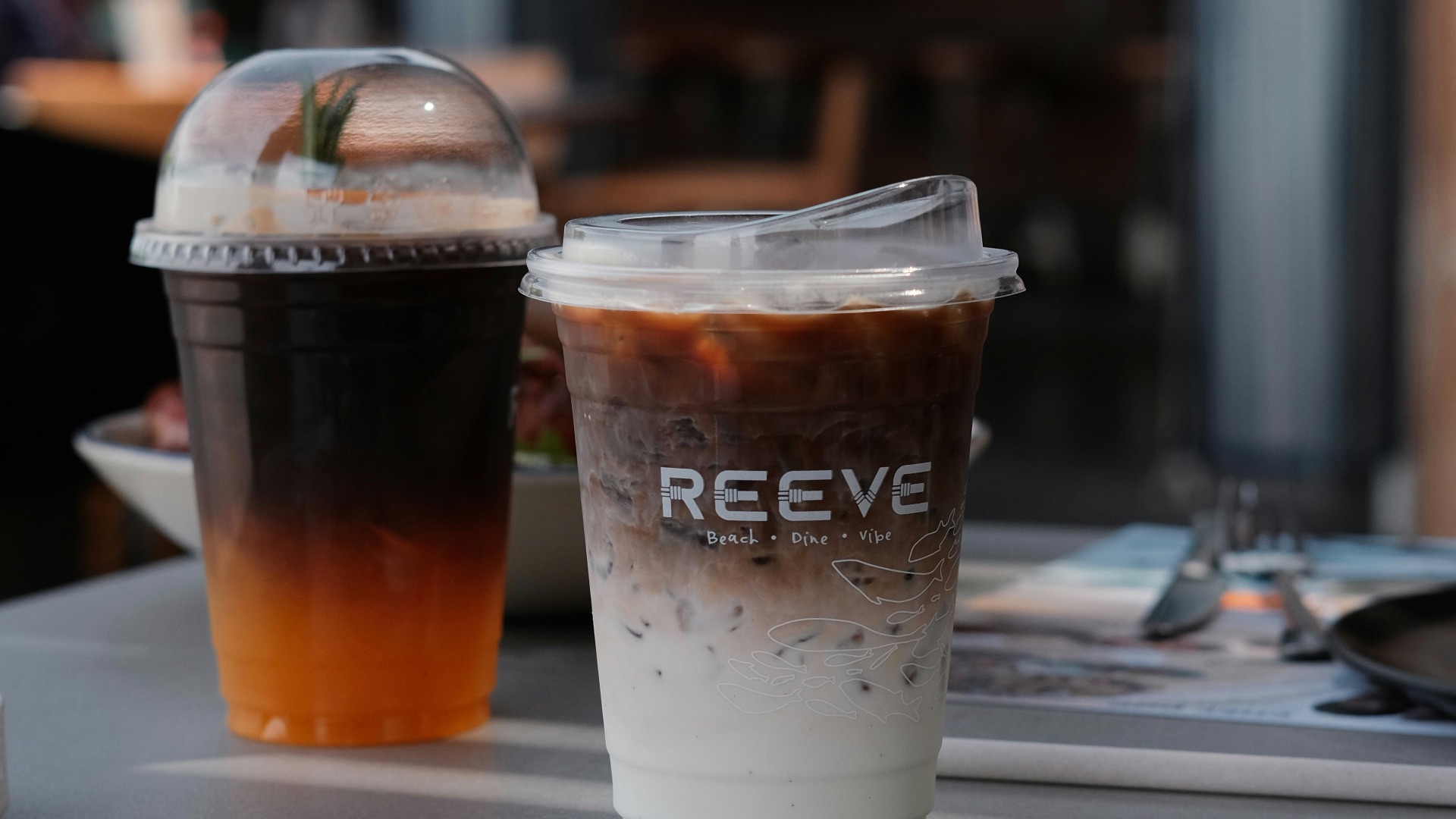 Two iced coffees on a table