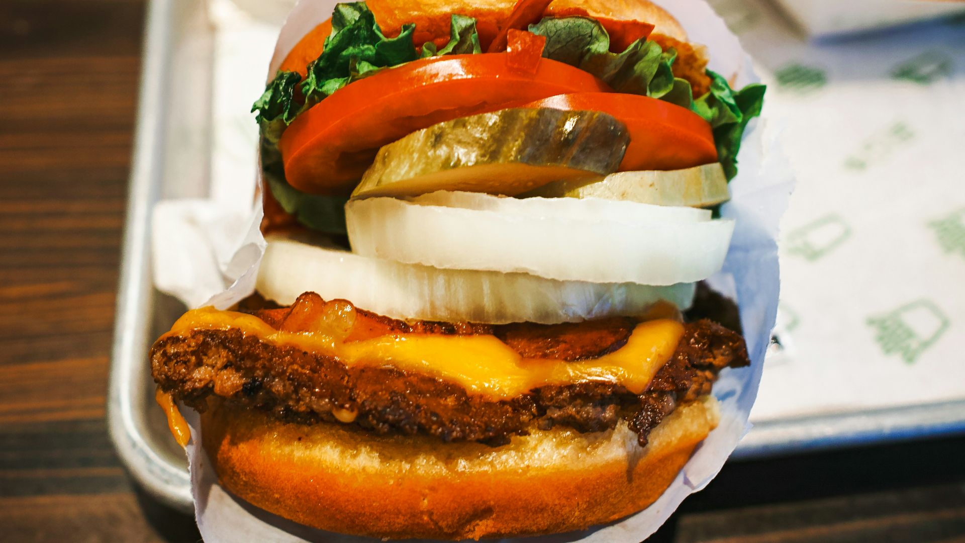 a tray with a sandwich and a bowl of fries