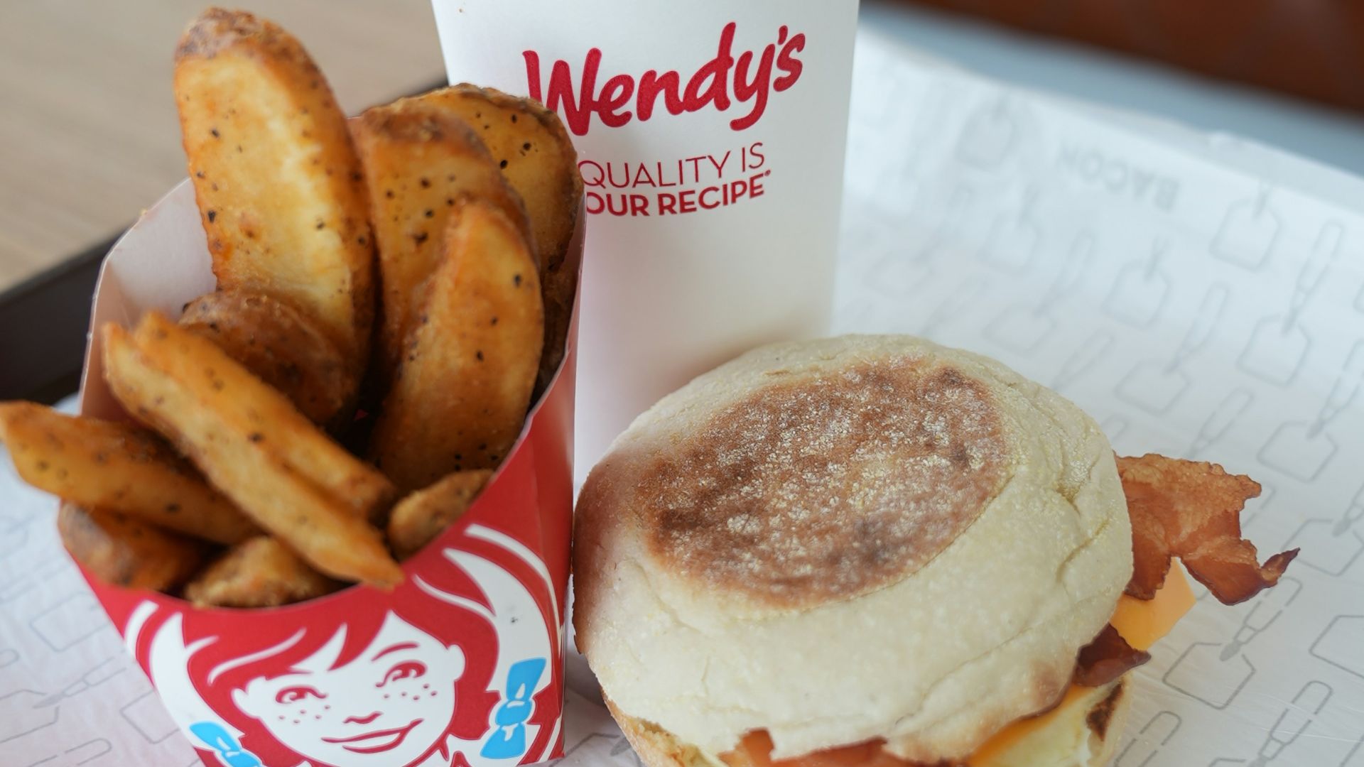 A tray with a sandwich and fries on it